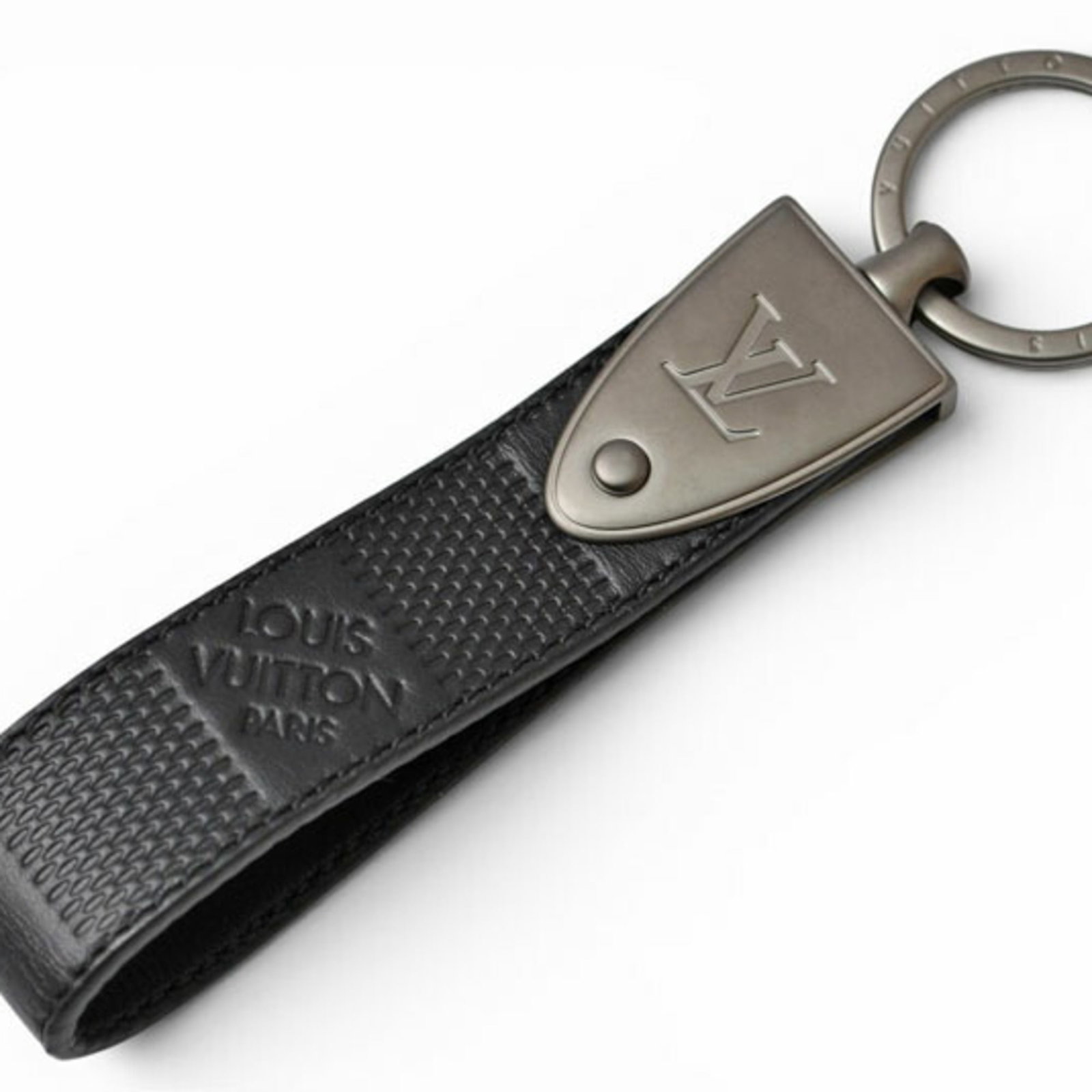 Metal Leather Keyring Louis Vuitton: Metal Leather Keyring Louis Vuitton Metal Leather Keyring Louis Vuitton features a durable metal ring and a high-quality leather strap, making it a stylish accessory for everyday use. The classic Dami