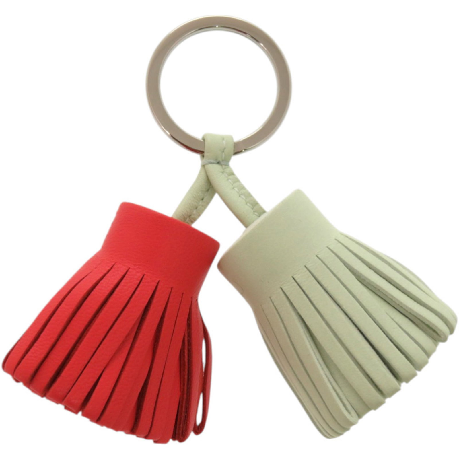 Keyring Agneau Milo Hermes: Keyring Agneau Milo Hermes Agneau Milo is a French material known for its unique, woven texture, giving this keyring its distinctive look. The multi-color design adds visual interest, while the Agneau