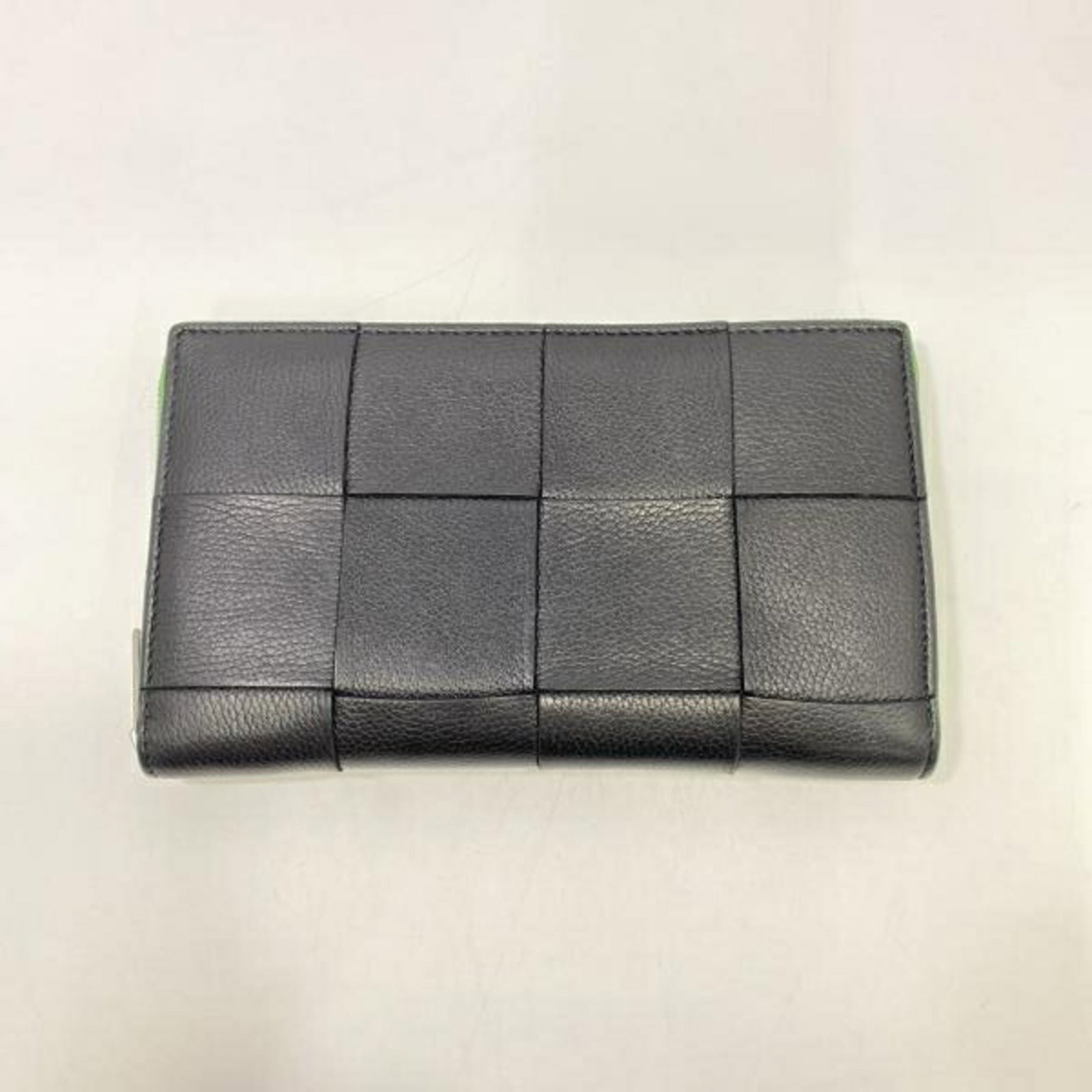 Zip Around Cassette Wallet Bottega Veneta: Zip Around Cassette Wallet Bottega Veneta Bottega Veneta's Zip Around Cassette Wallet is a sleek and modern accessory, featuring a distinctive zip closure and a compact design. Made from high-quality