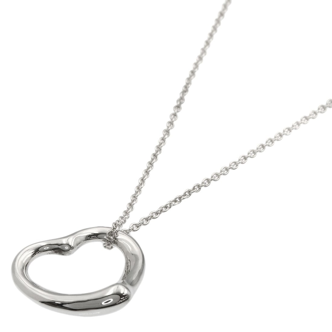 Open Heart Necklace by Tiffany & Co: Open Heart Necklace by Tiffany & Co Silver Open Heart Necklace by Tiffany & Co, featuring a sleek 16.3inch design with a silver exterior. This elegant necklace showcases the iconic Tiffany & Co. style