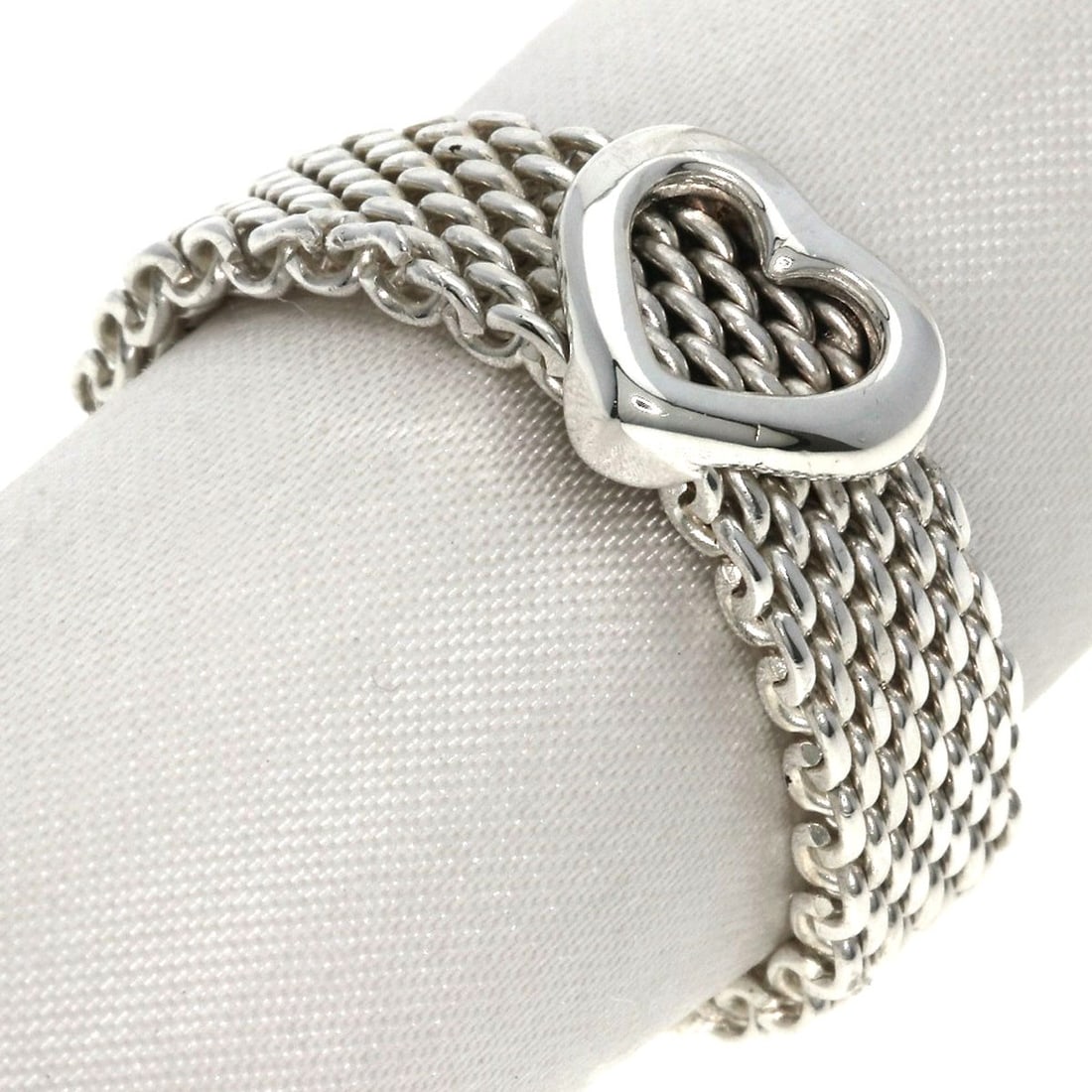 Tiffany&Co Somerset Heart Mesh Silver Ring: Tiffany&Co Somerset Heart Mesh Silver Ring Silver Mesh Ring with a sleek design from Tiffany&Co. Features a mesh pattern in silver metal, available in size 9.25(US). No main stone is present on this r