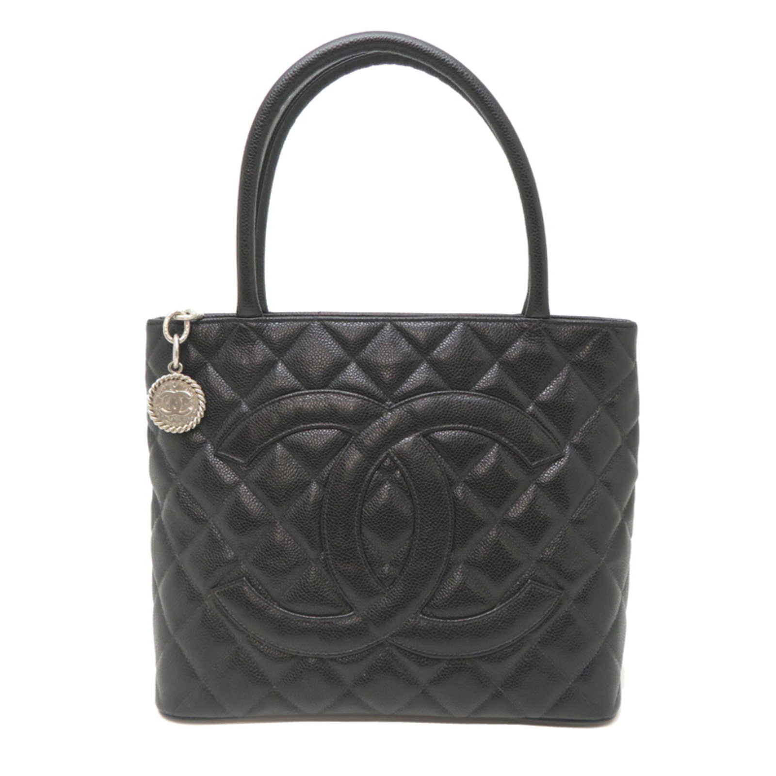 Calfskin Tote Bag Chanel: Calfskin Tote Bag Chanel Calfskin Tote Bag Chanel bears a signature. Made from high-quality grained Calfskin, this black tote bag features a classic design with a timeless appeal. Measuring 25cm x