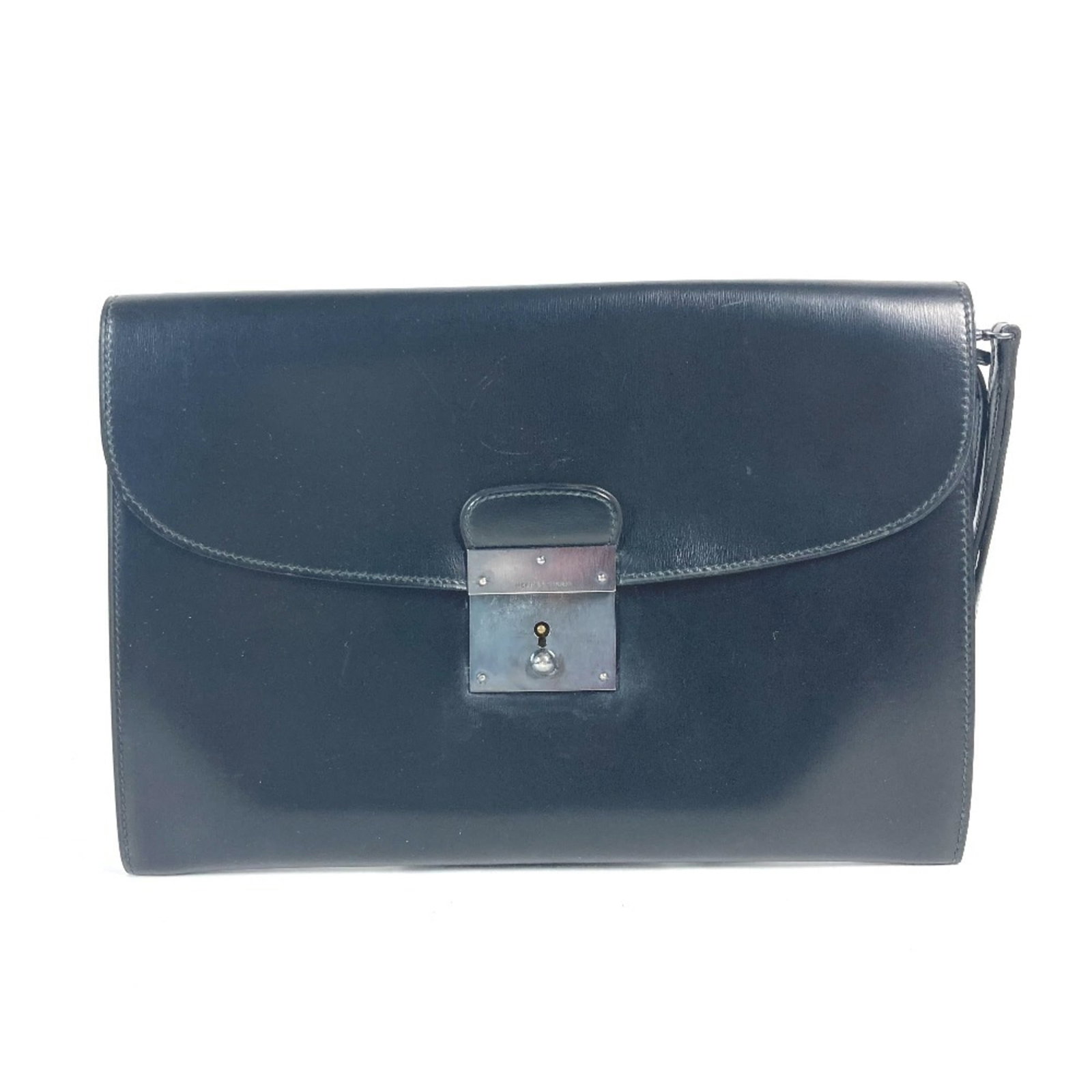 Calf Leather Pouch Bag Box Hermes: Calf Leather Pouch Bag Box Hermes Box calf leather construction provides a rich, luxurious feel to this black clutch bag, with a sleek 17.5cm x 25.5cm size that fits neatly in the hand. The bag's box