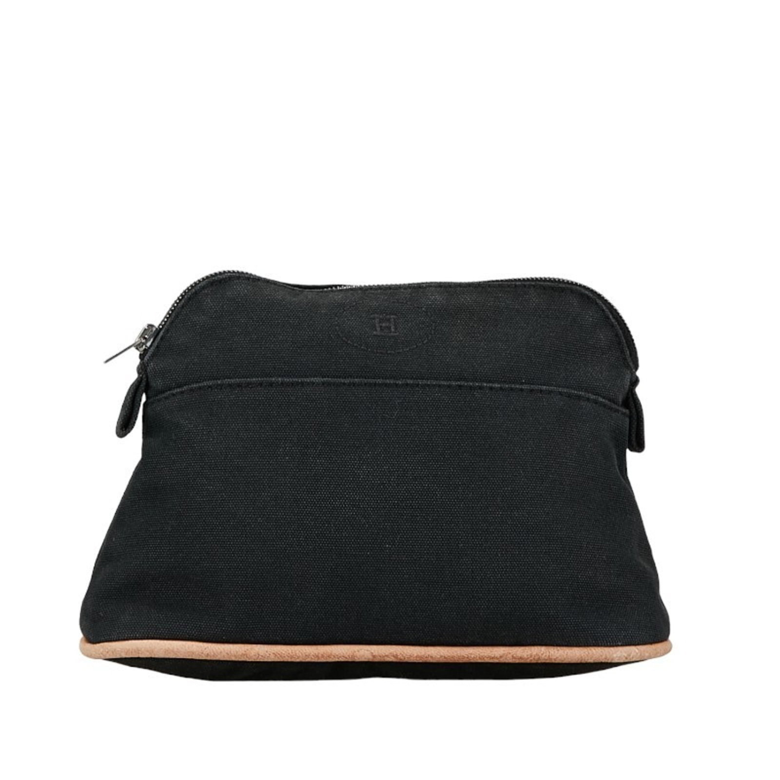 Canvas leather Hermes pouch: Canvas leather Hermes pouch Canvas leather pouch from Hermes, featuring a black color and zipper closure. Measuring 13cm x 20cm x 5cm, this compact pouch is designed to be a stylish and functional