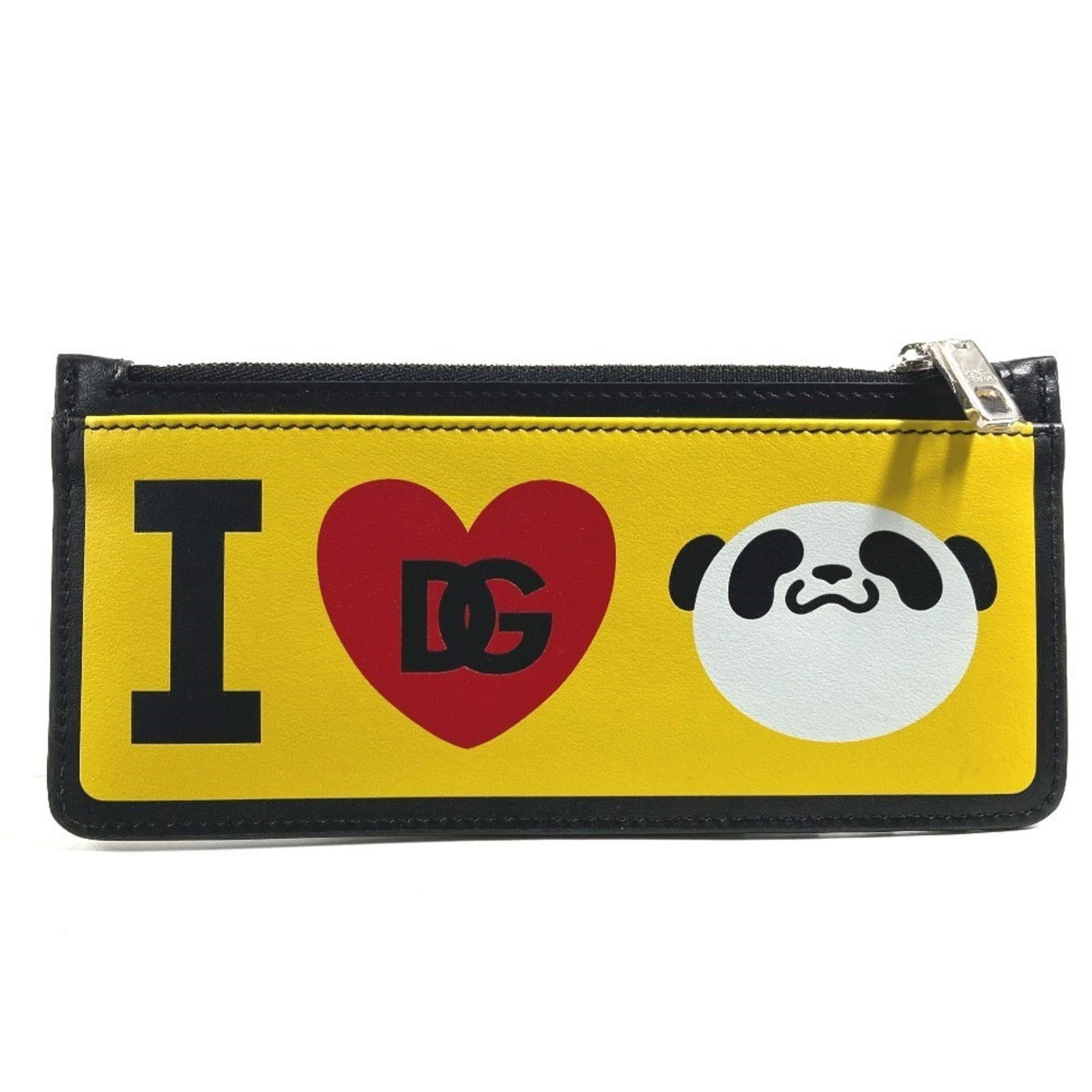 Dolce & Gabbana Coin Purse/ Coin Case Leather: Dolce & Gabbana Coin Purse/ Coin Case Leather The Dolce & Gabbana Coin Purse/ Coin Case Leather is a sleek and stylish accessory made from high-quality black and yellow leather. Measuring 8cm x