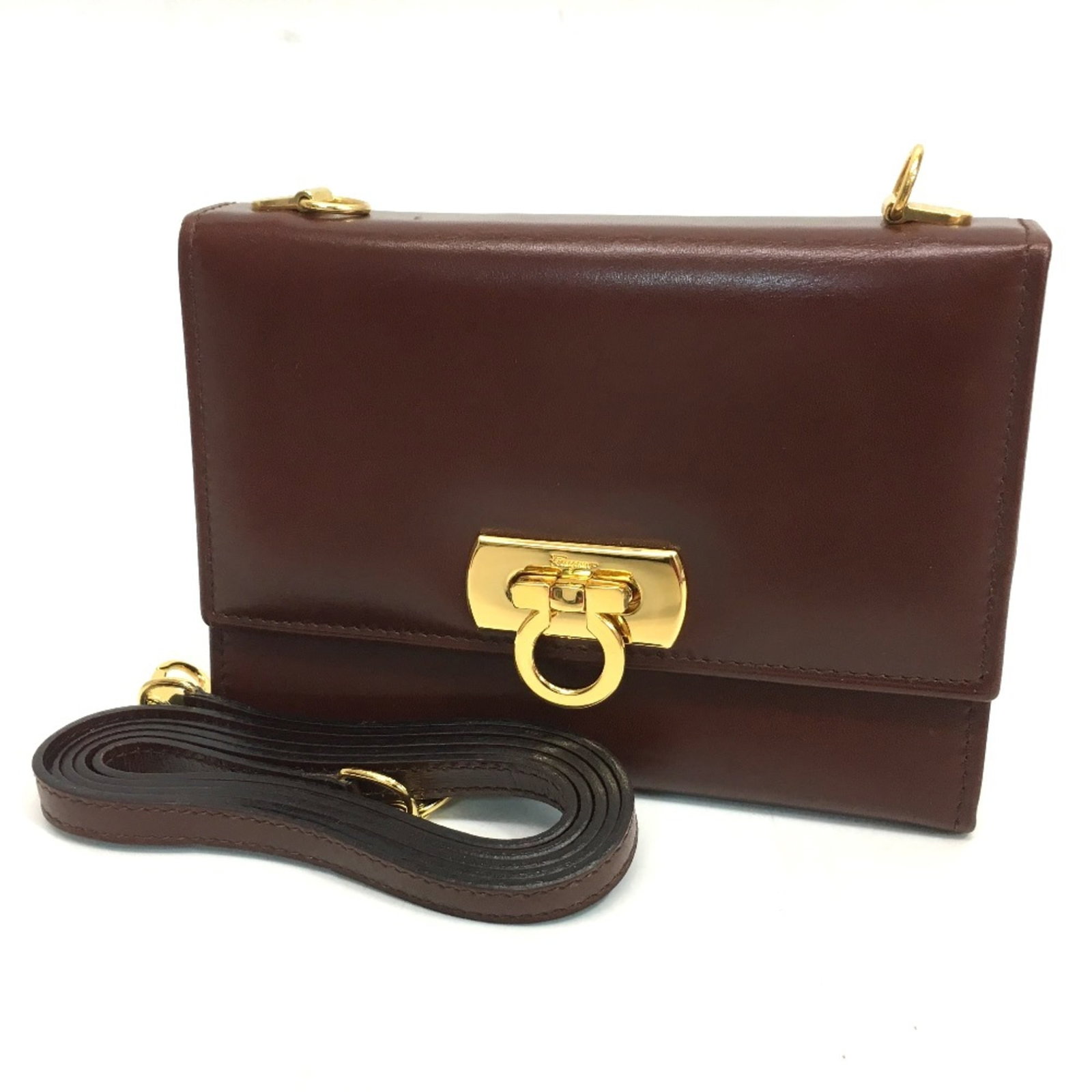 Ferragamo Leather Shoulder Bag: Ferragamo Leather Shoulder Bag The Salvatore Ferragamo Leather Shoulder Bag is a timeless piece, boasting a classic brown leather design with clean lines and a sleek shape. Measuring 14.5cm x 10.5cm