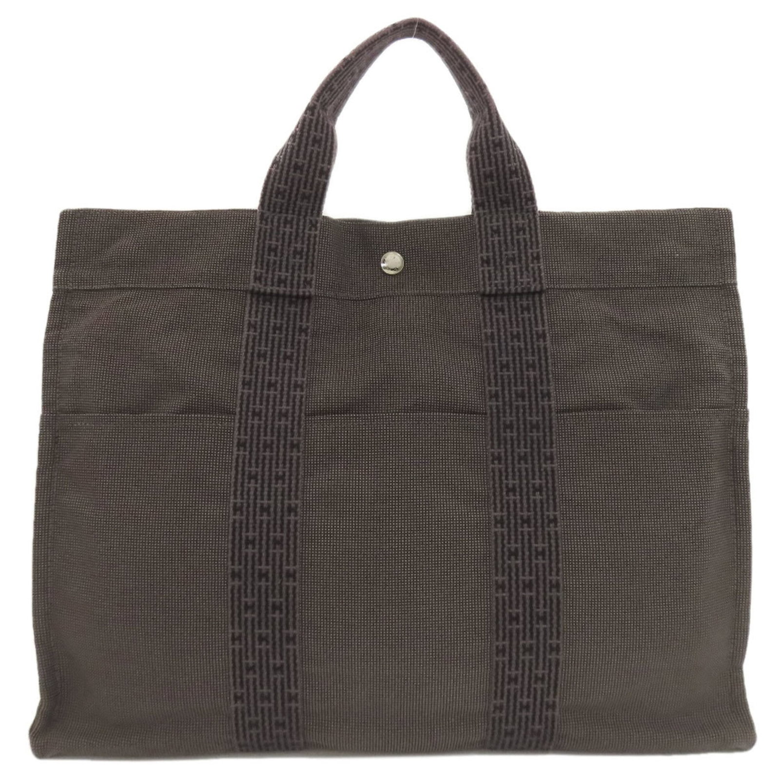 Handbag Canvas: Handbag Canvas Canvas Handbag by Hermes. Made from high-quality canvas, this gray handbag measures 32cm x 43cm x 11cm and features a classic design. The bag is a straightforward, no-frills accessory w