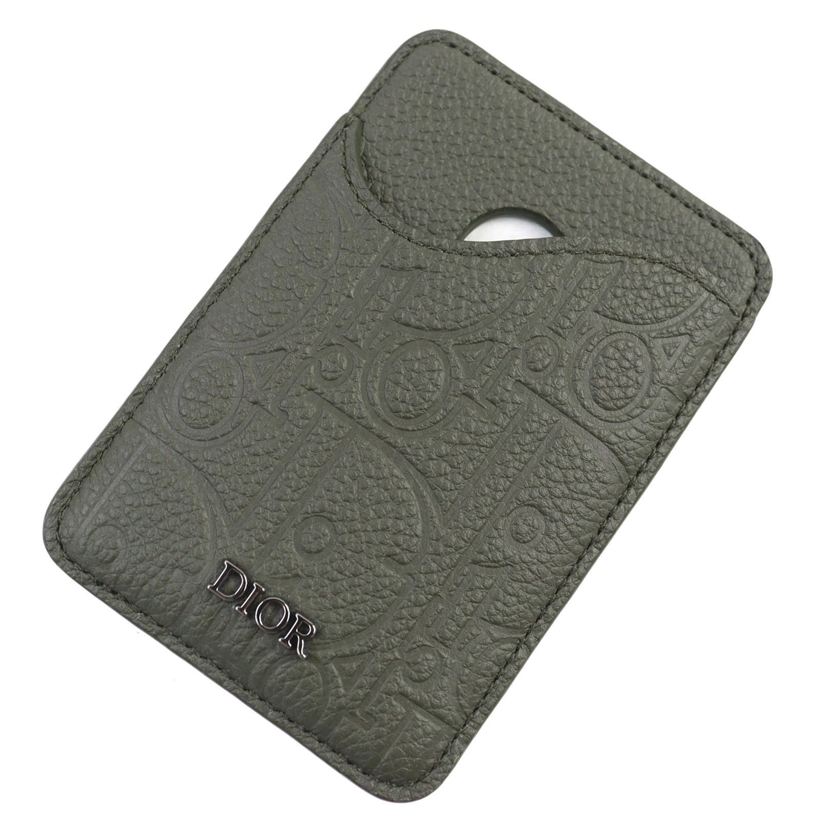 Card Case Leather By Dior: Card Case Leather By Dior Card case by Christian Dior, made from high-quality Italian leather, features a khaki color and measures 9.5cm x 6.5cm. Includes a dust bag for protection and storage. A