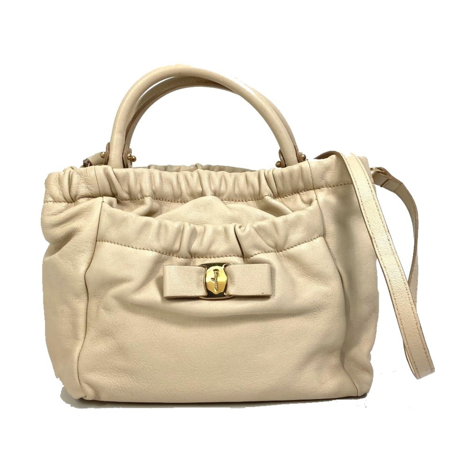 Salvatore Ferragamo Handbag Leather: Salvatore Ferragamo Handbag Leather Salvatore Ferragamo Handbag Leather is a high-quality, beige leather handbag with a classic design. Measuring 22cm x23cm x11cm, it features a sturdy base and a