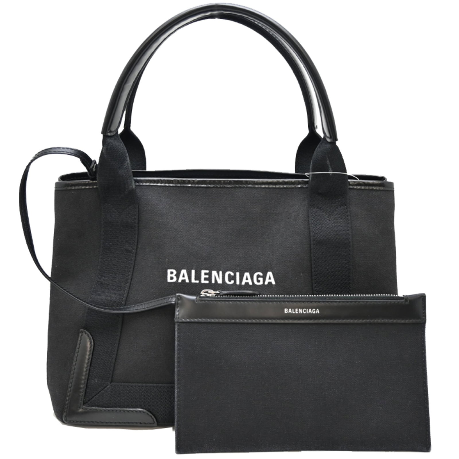 Tote Bag Canvas Leather Balenciaga: Tote Bag Canvas Leather Balenciaga Canvas and leather combine in a sleek, black tote bag from Balenciaga, measuring 22cm x 30cm x 17cm. The bag's canvas and leather materials provide a durable and
