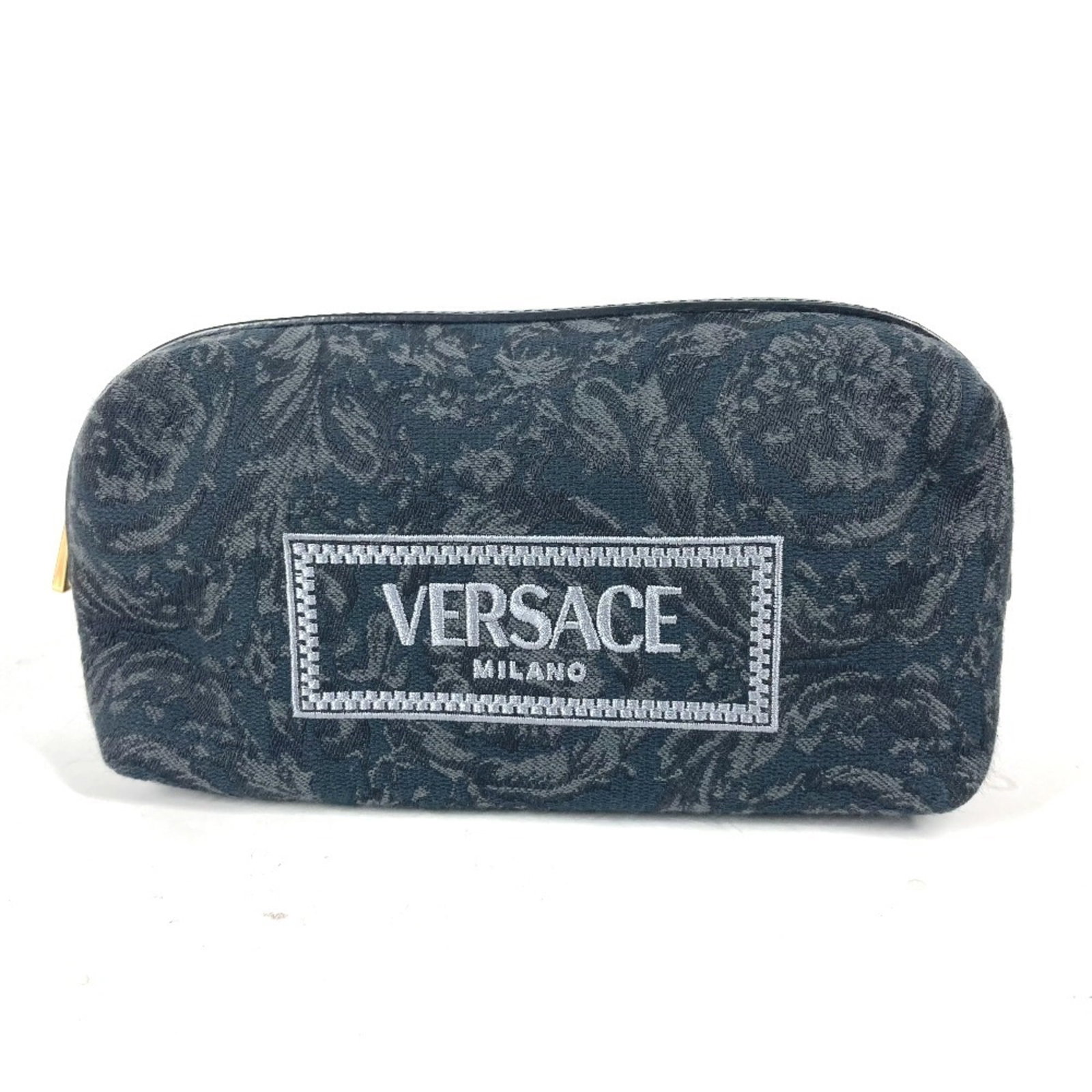 Canvas Pouch Versace: Canvas Pouch Versace Canvas pouch from Versace, made from high-quality canvas material in black and gray colors, featuring a signature. This stylish pouch measures 11.5cm x 18.5cm and is a great