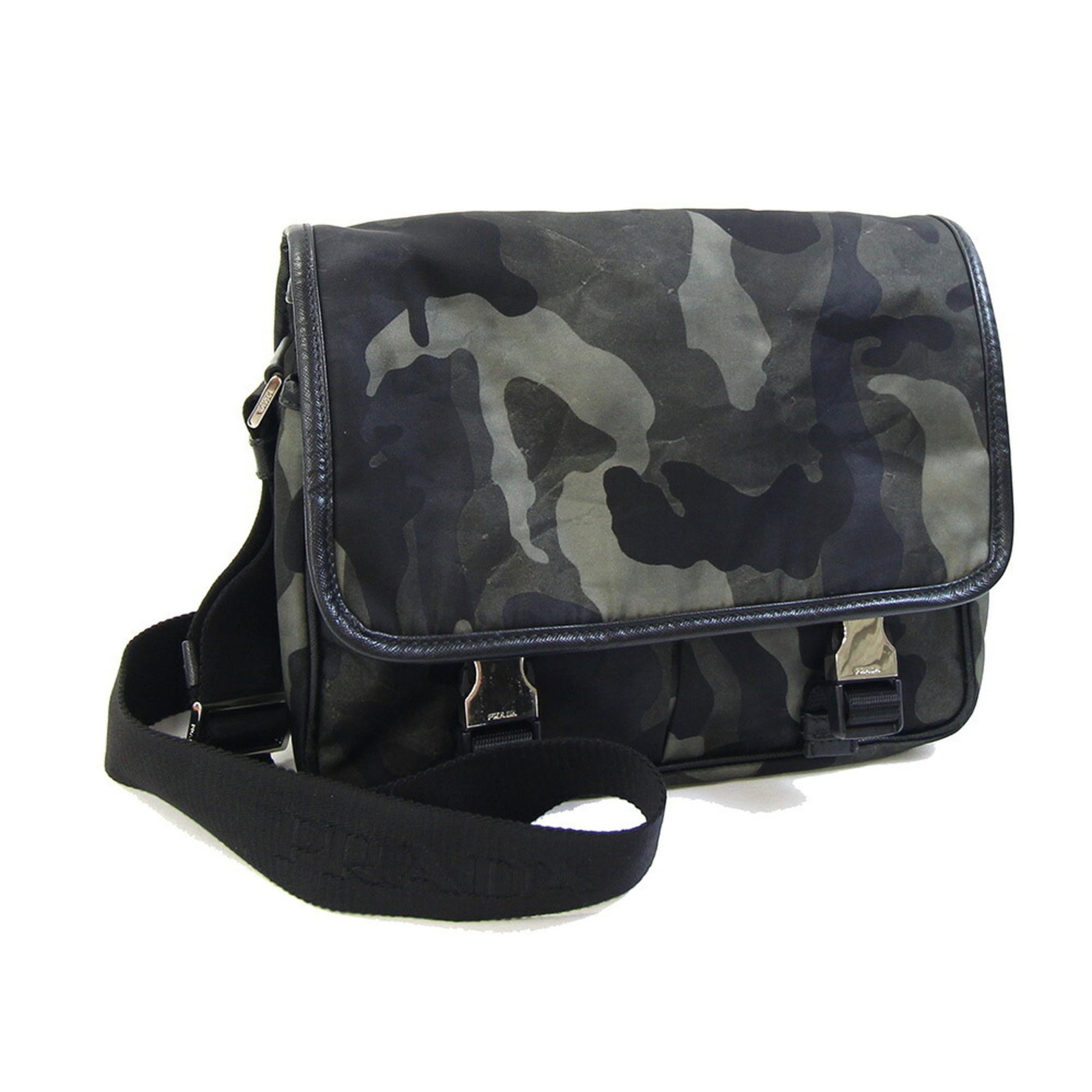 Shoulder Bag Nylon Leather Prada: Shoulder Bag Nylon Leather Prada Nylon and leather combine in this sleek shoulder bag from Prada, available in black, brown, green, and khaki. The bag measures 21cm x 24cm x 9cm and features a