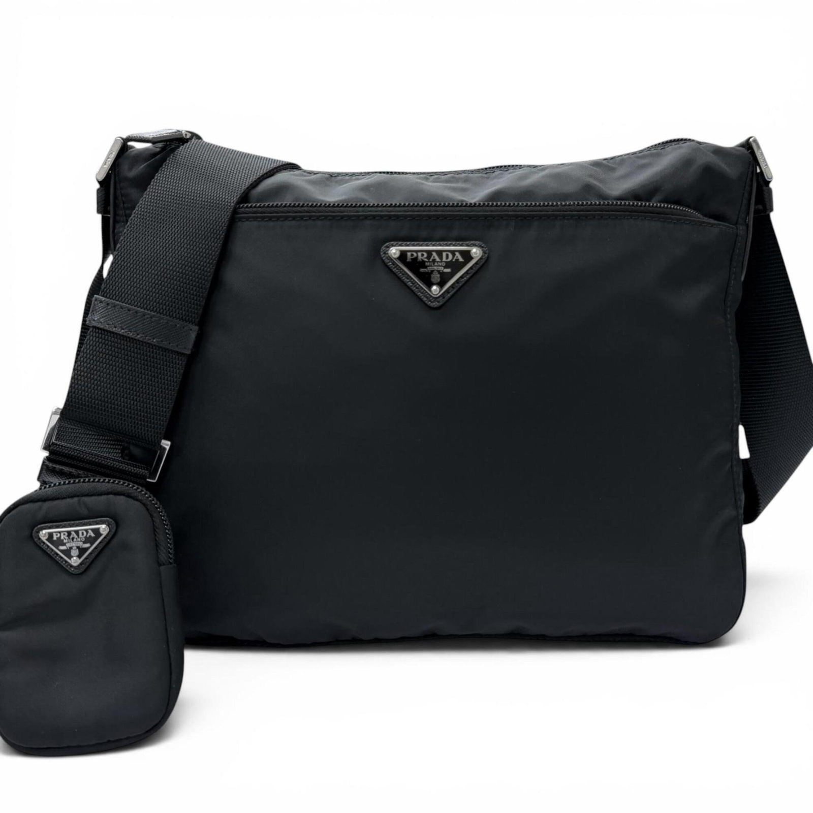 Nylon Leather Shoulder Pouch Bag Prada: Nylon Leather Shoulder Pouch Bag Prada Nylon leather shoulder pouch bag from Prada, featuring a classic design with a black finish. Made from a combination of nylon and leather, this bag measures 26cm