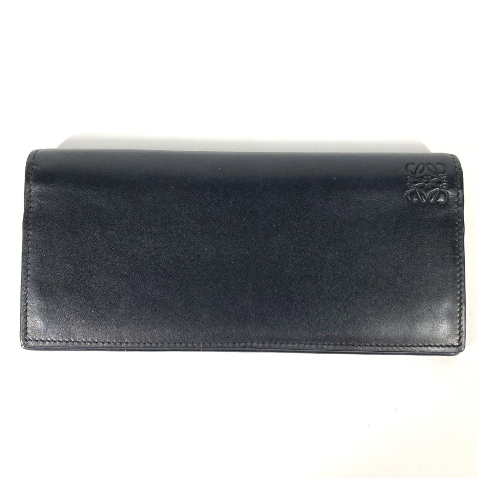 Leather Bi Fold Long Wallet: Leather Bi Fold Long Wallet Black leather bi-fold long wallet with a classic design, measuring 19cm x 9cm (width x height) and 7.5cm x 3.5cm (inner width x inner height). Made from high-quality
