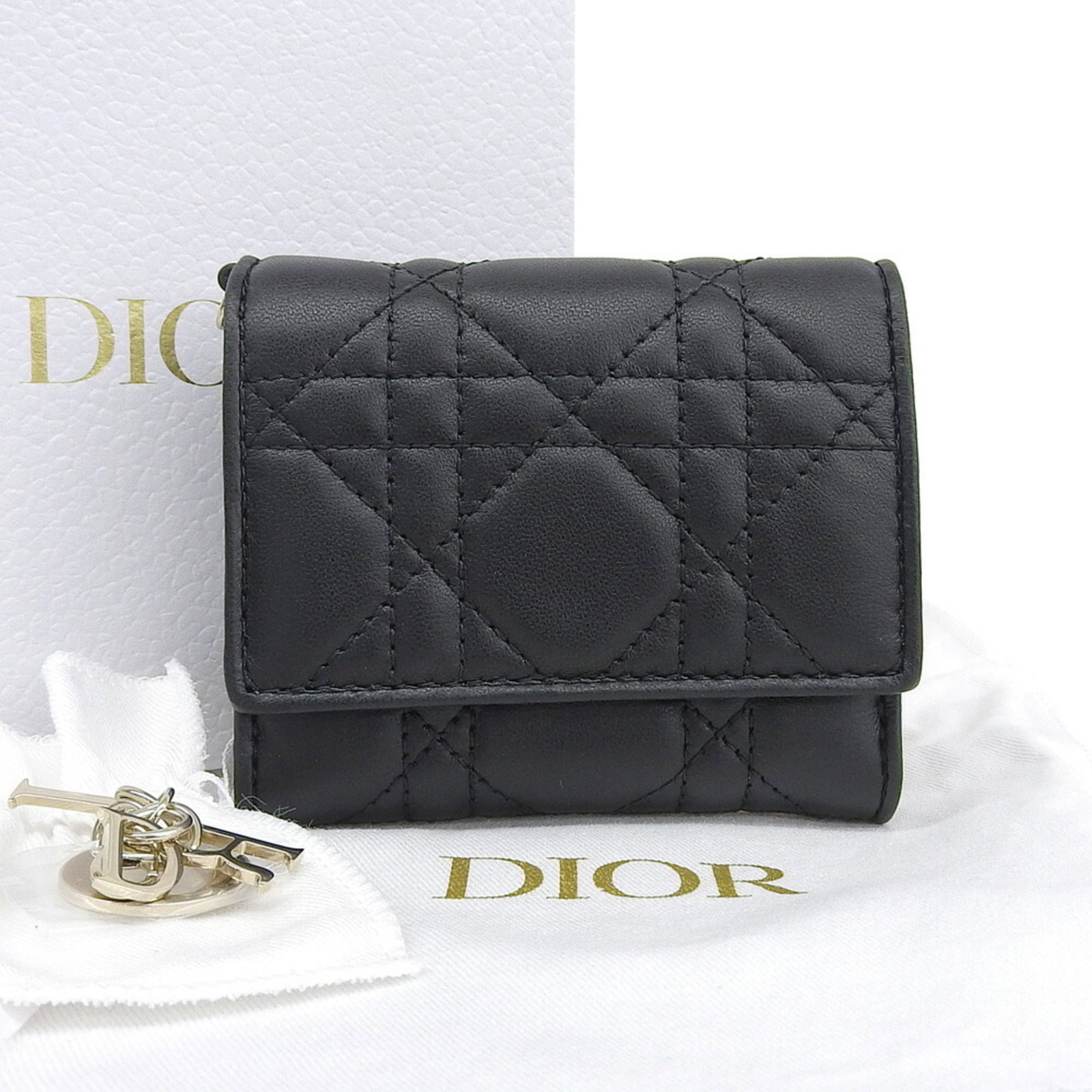 Christian Dior Wallet (Tri-Fold) Leather: Christian Dior Wallet (Tri-Fold) Leather Tri-fold leather wallet from Christian Dior, crafted from lambskin and available in black. Measuring 8.5cm x 10cm x 3cm, this wallet features a classic design