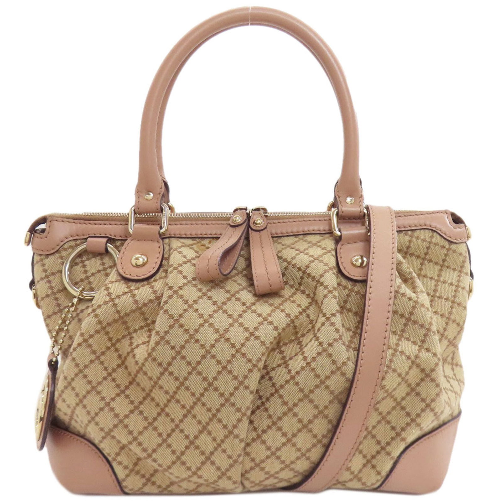 Handbag Canvas Gucci: Handbag Canvas Gucci Canvas Gucci handbag with a unique combination of beige and pink beige hues, featuring a zipper closure, two pockets, and adjustable straps. This stylish bag measures 22cm x 32cm