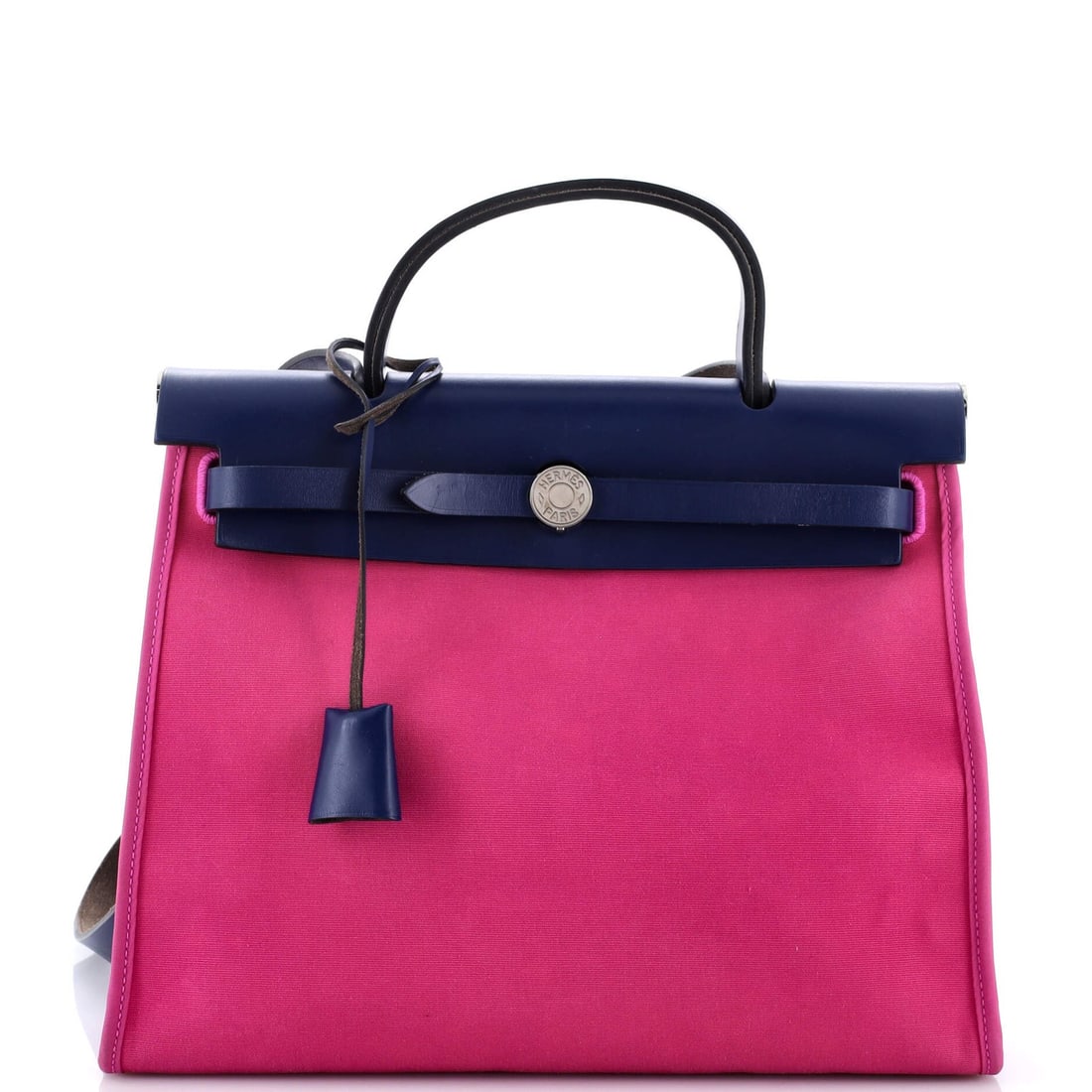 Herbag Hermes Leather Toile 31 Zip: Herbag Hermes Leather Toile 31 Zip The Herbag Hermes Leather Toile 31 Zip is a stylish shoulder bag with a unique blend of pink and blue hues. Featuring a canvas interior and palladium hardware, this