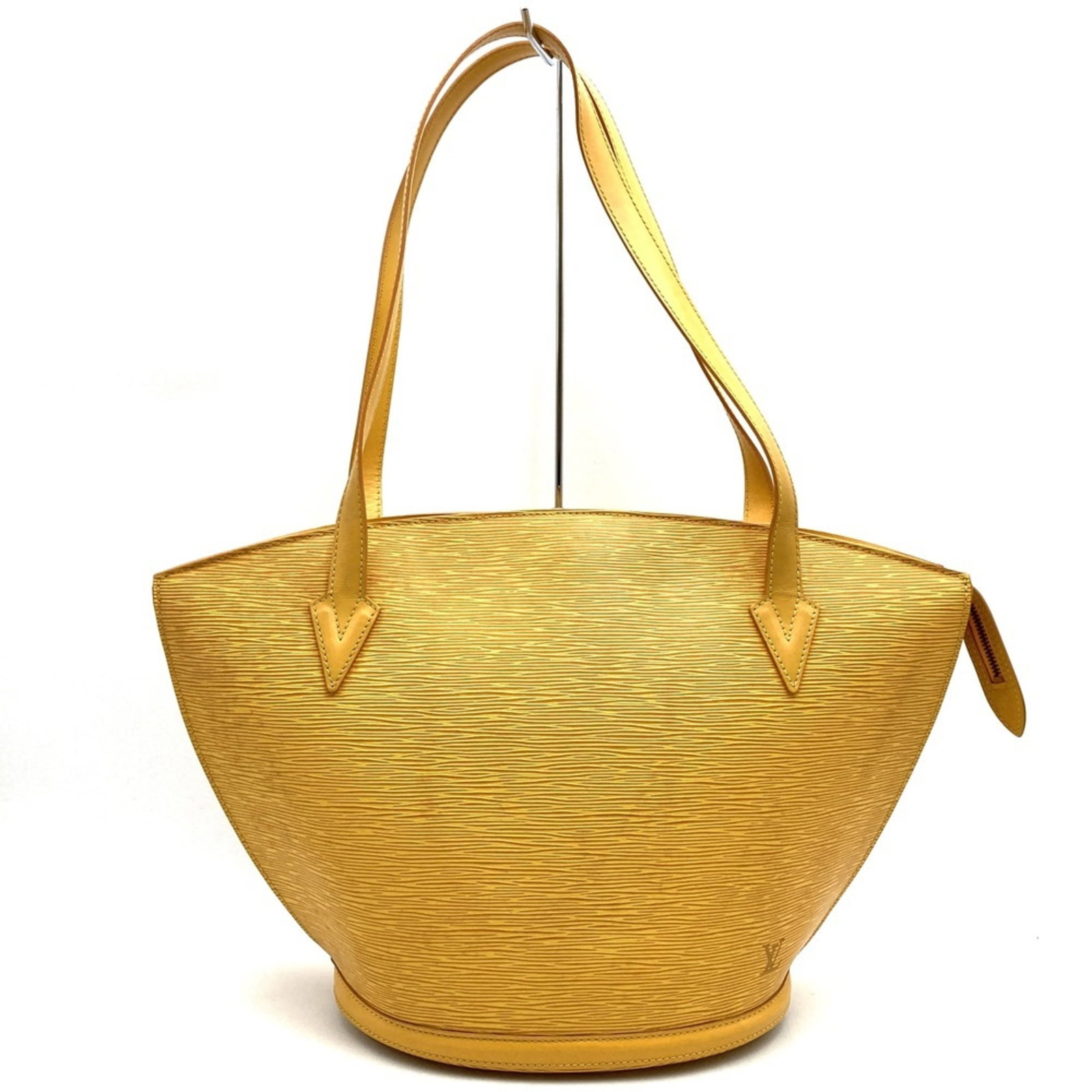 Leather Epi Bag Vuitton Louis: Leather Epi Bag Vuitton Louis This iconic Epi bag from Louis Vuitton boasts a striking yellow Epi leather exterior, accentuated by a sturdy zipper closure. Measuring 29cm x 44cm x 17cm, it features a