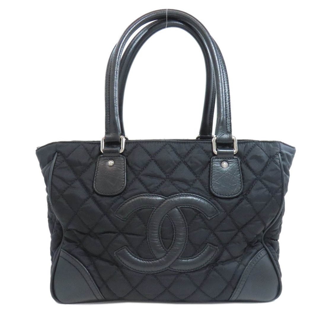 Chanel Paris New York Silverhardware Tote Bag Nylon: Chanel Paris New York Silverhardware Tote Bag Nylon Black Chanel Paris New York Silver Hardware Tote Bag in Nylon. This tote bag features silver hardware and is made of nylon. The classic design of
