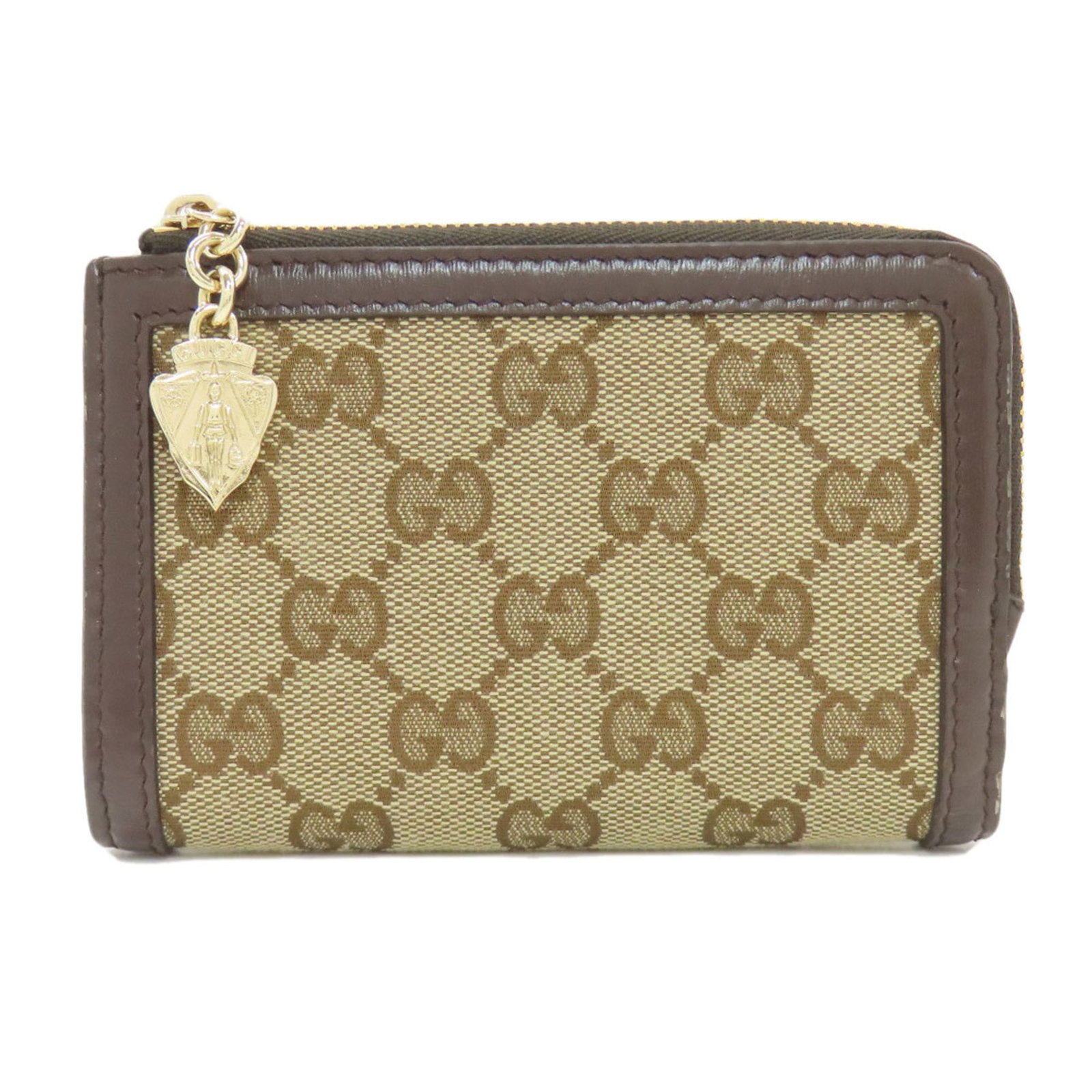 Bi Fold Canvas Gucci Wallet: Bi Fold Canvas Gucci Wallet Brown canvas bi-fold wallet from Gucci, measuring 8cm x 13cm x 2cm, bears a signature. This canvas wallet features a classic bi-fold design, making it a stylish accessory