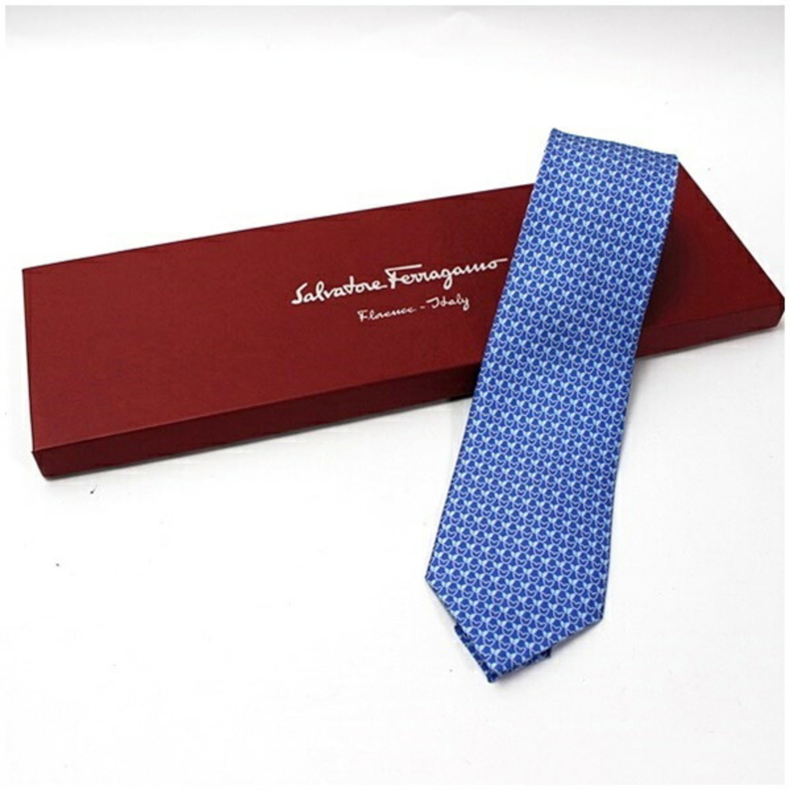 Ferragamo Salvatore Silk Cravat: Ferragamo Salvatore Silk Cravat Silk cravat in blue and light blue hues, featuring a 8cm width. Made from high-quality silk, this cravat is a stylish accessory for formal occasions. Item Specifics: