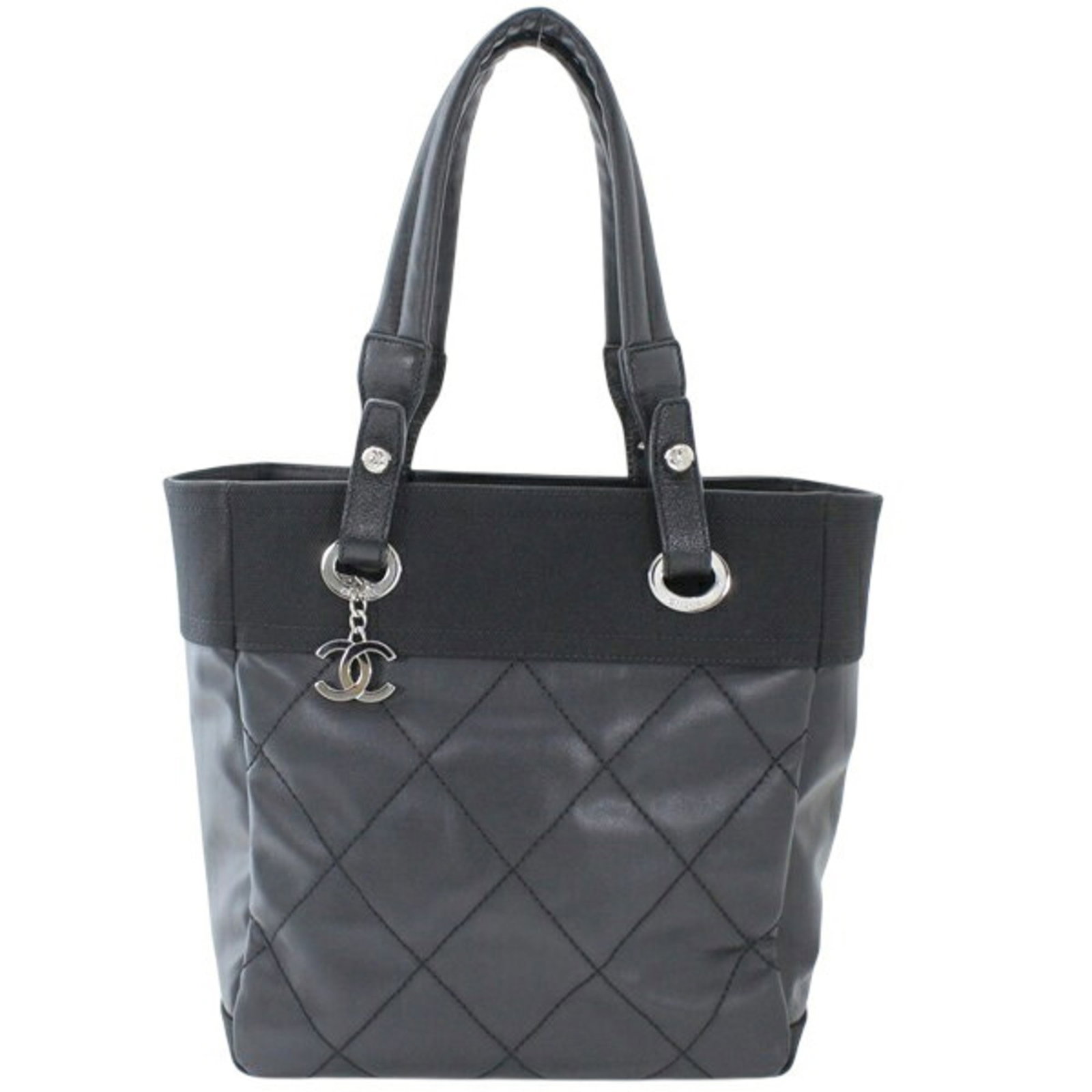 Pvc Leather Chanel Tote Bag: Pvc Leather Chanel Tote Bag PVC leather Chanel tote bag with calfskin details, available in black. This bag measures 27cm x 25cm x 11cm and features a unique blend of PVC and leather materials. Its