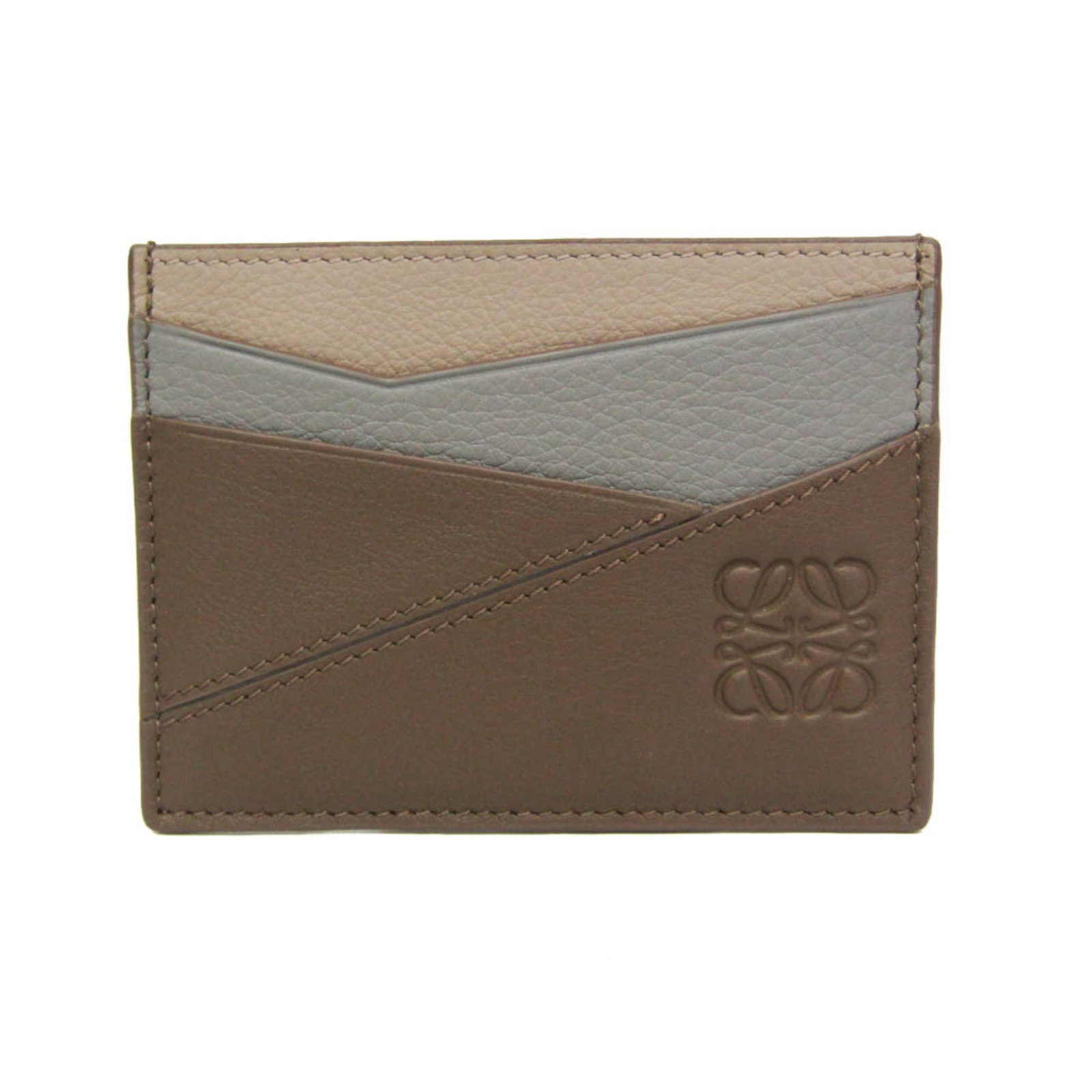 Card Case Leather by Loewe: Card Case Leather by Loewe The Card Case Leather by Loewe is a sleek and sophisticated accessory, featuring a classic design with a simple open closure and a single outer pocket with card slots. Made 