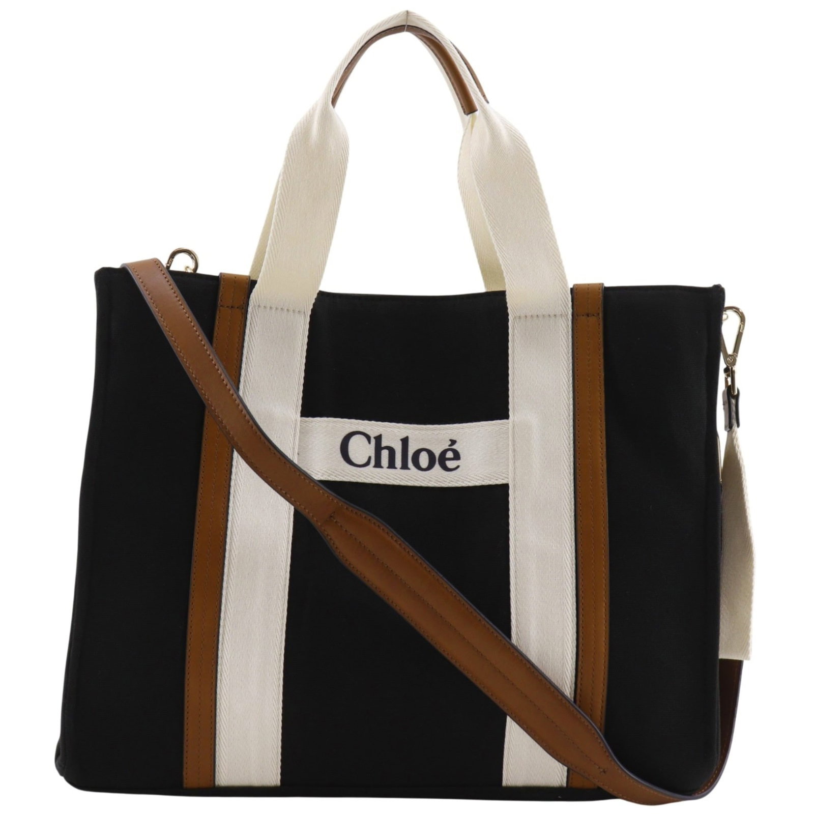 Canvas Chlo Tote: Canvas Chlo Tote Canvas Chlo Tote in Black.This canvas tote bag features a classic design with a black color and a sturdy canvas material. Measuring 33cm x 40cm x 13cm, it has a comfortable handle