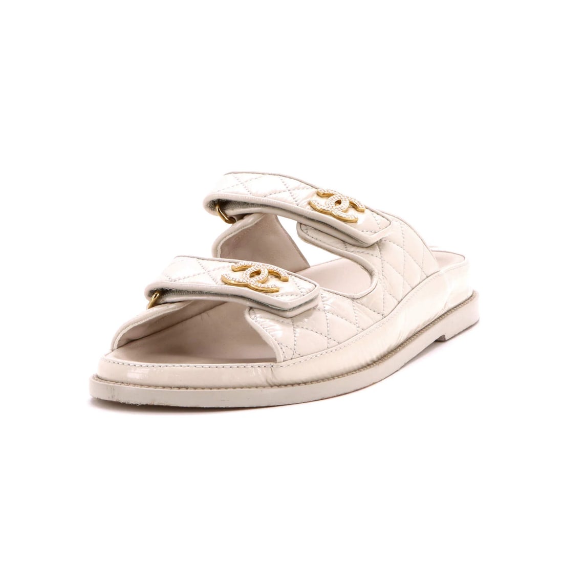 Women's Quilted Calfskin Sandals Open Back Dad Chanel: Women's Quilted Calfskin Sandals Open Back Dad Chanel Neutral-colored quilted calfskin sandals with a shiny exterior and gold hardware feature a velcro open back design, perfect for adding a touch of
