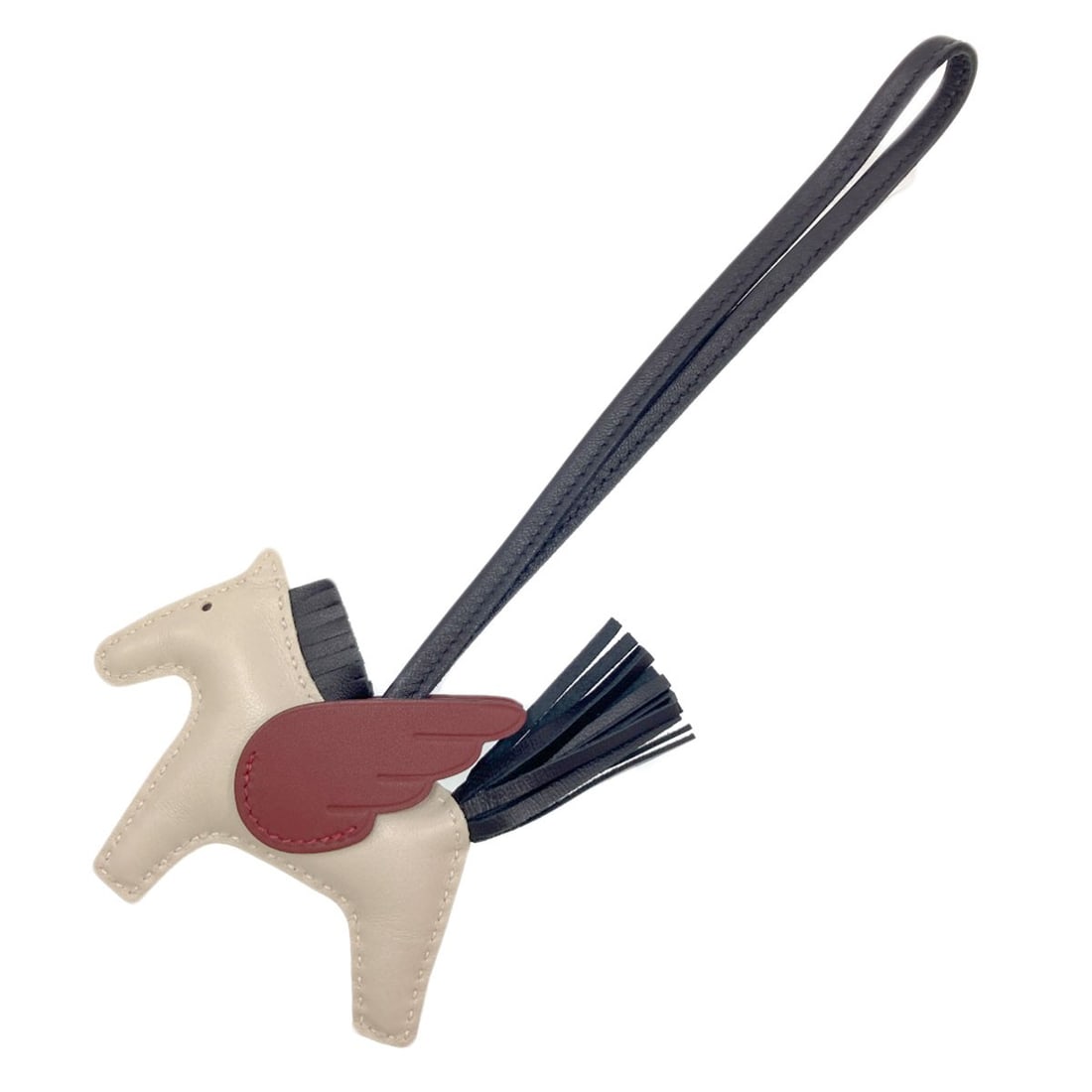 Miro Anyo Ring Key Pegasus Charm Rodeo Hermes: Miro Anyo Ring Key Pegasus Charm Rodeo Hermes White Anyo Miro key ring features a striking Pegasus charm, a classic design from the renowned French fashion house Hermes. The elegant white exterior