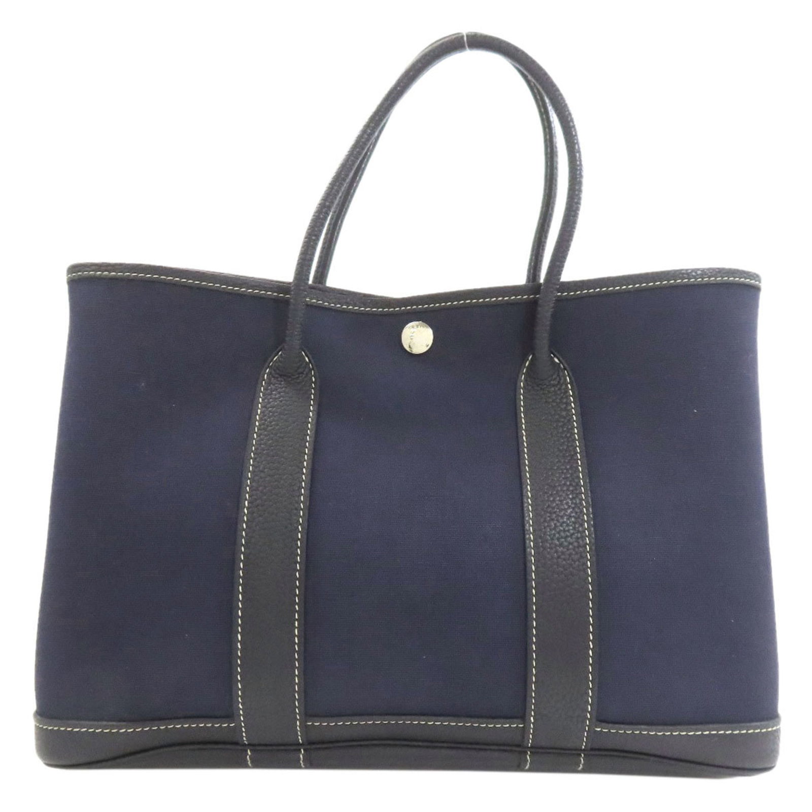 Officier Tote Bag Hermes Toile: Officier Tote Bag Hermes Toile Navy blue Herm?s Toile tote bag with classic 21cm x 30cm x 13cm dimensions, perfect for everyday use. This iconic design features the timeless Herm?s Toile officier