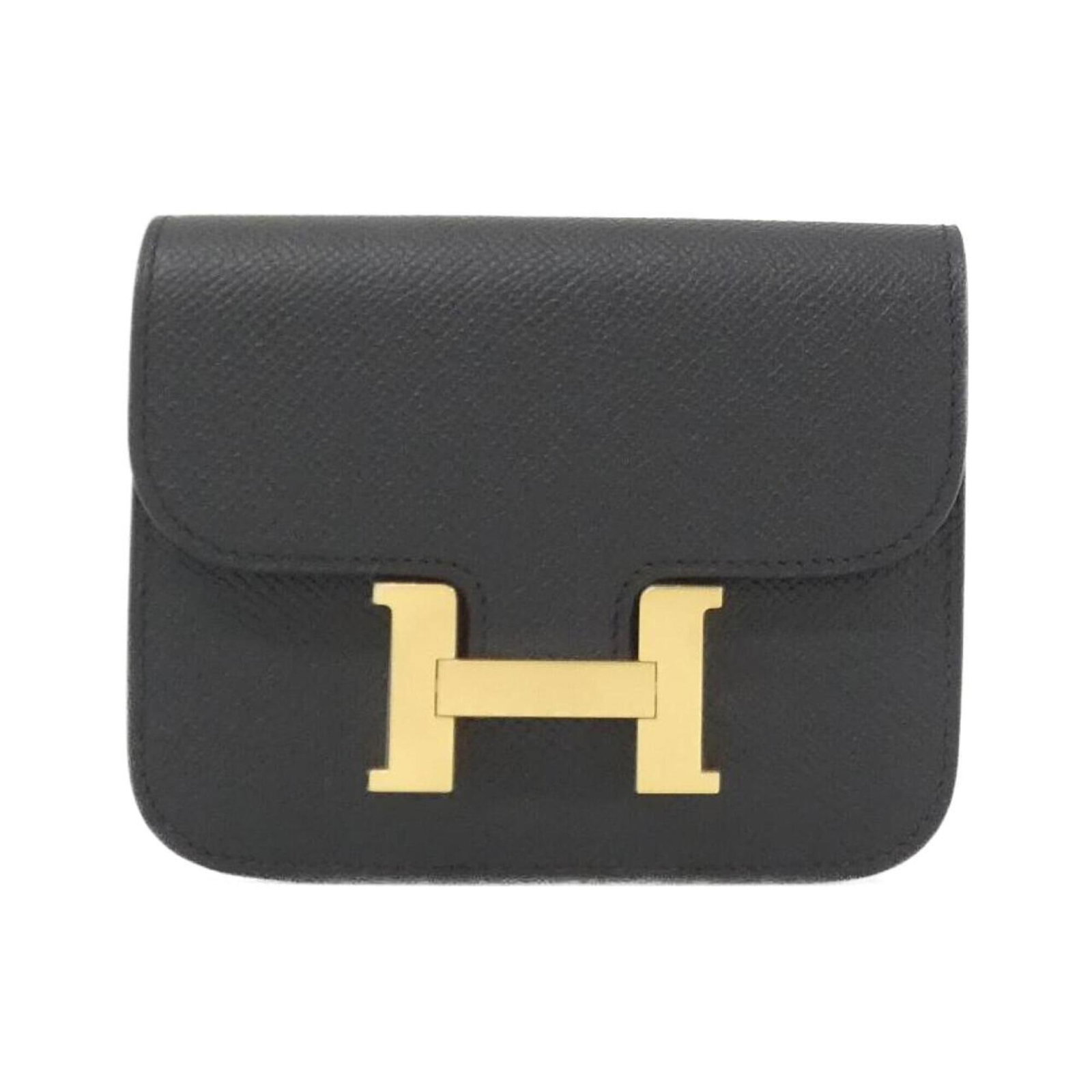 Bi fold Epsom Leather Hermes Wallet: Bi fold Epsom Leather Hermes Wallet Epsom leather provides a luxurious feel to this bi-fold wallet from Hermes, with a sleek black finish that adds a touch of sophistication to any outfit. The