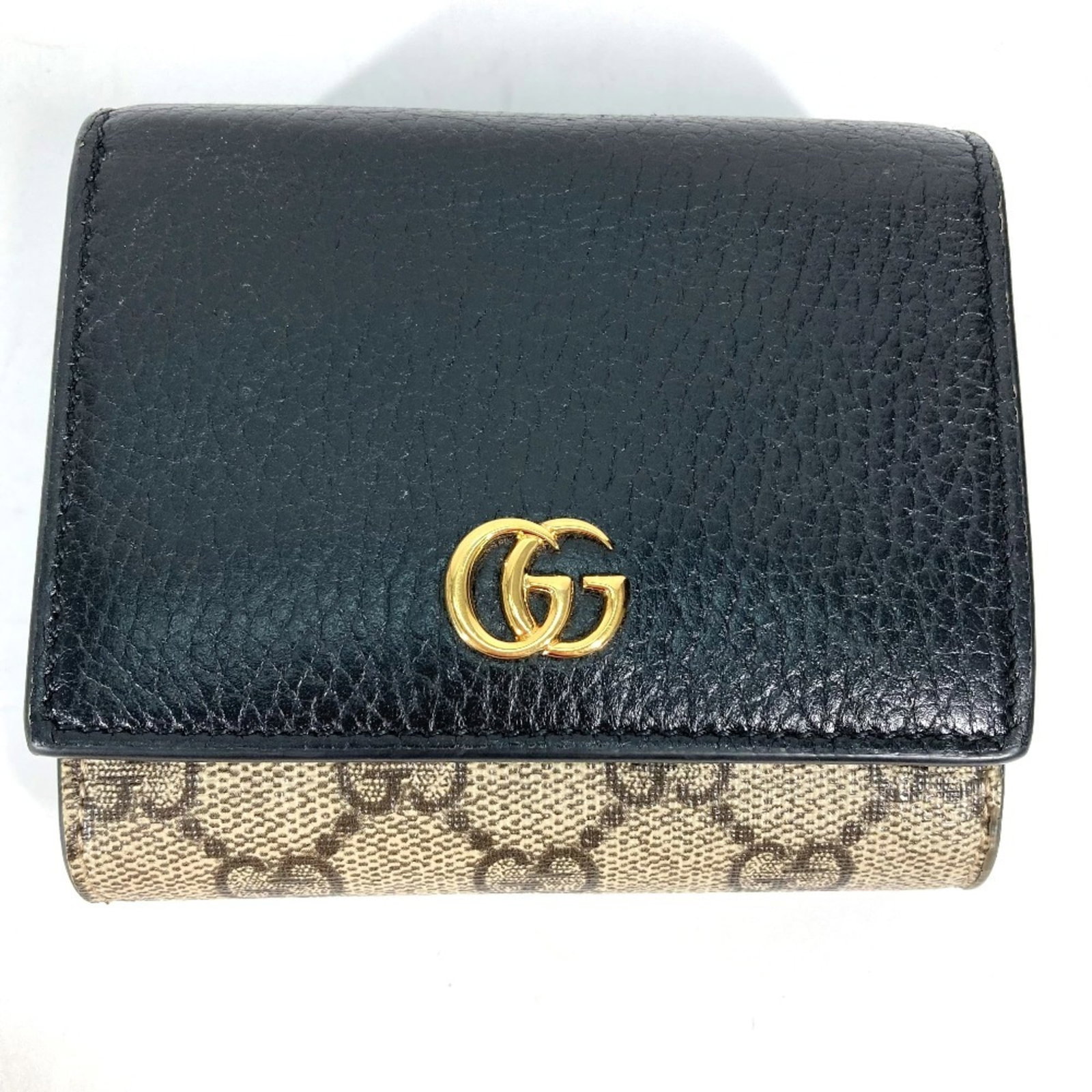Leather Pvc Bi Fold Wallet: Leather Pvc Bi Fold Wallet Leather and PVC materials blend in this bi-fold wallet from Gucci, offering a unique fusion of styles. The beige and black color combination adds a touch of sophistication, 