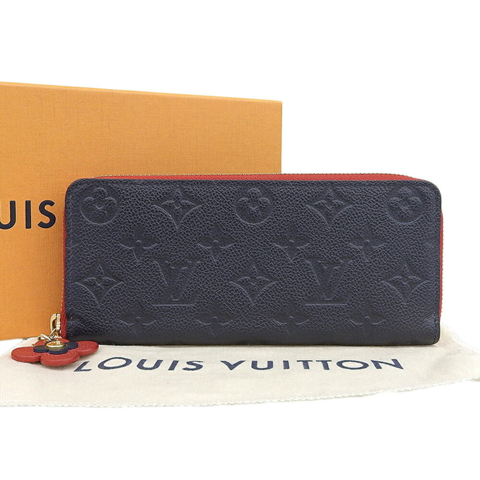 Louis Vuitton Purse Case Monogram Coin Empreinte: Louis Vuitton Purse Case Monogram Coin Empreinte Monogram Empreinte coin purse case from Louis Vuitton, featuring the iconic Marine rouge and navy monogram pattern. This stylish accessory measures