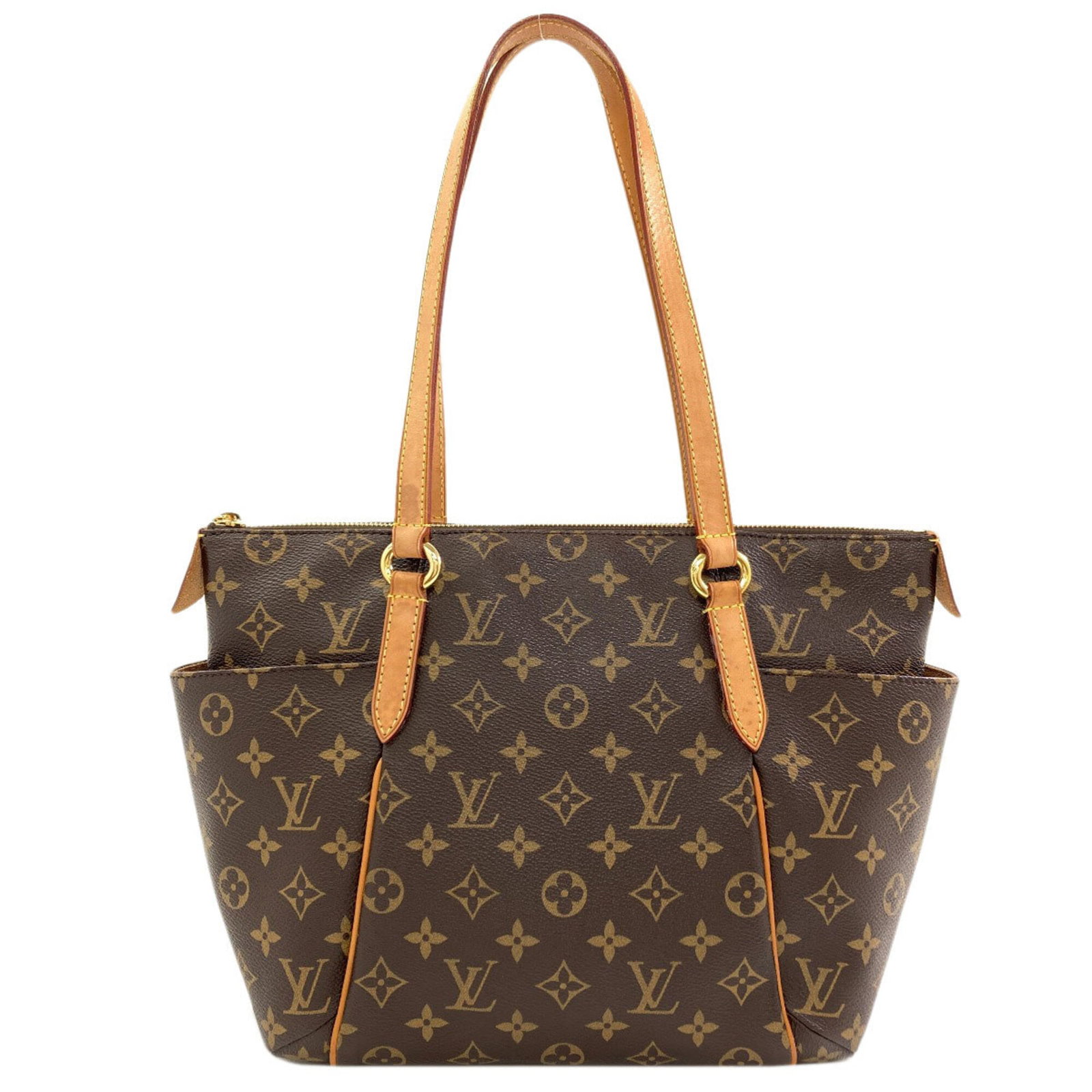 Louis Vuitton Monogram Tote: Louis Vuitton Monogram Tote Monogram pattern adorns this iconic Louis Vuitton tote, crafted from high-quality materials. Measuring 24cm x 34cm x 11cm, it offers a stylish and practical solution for