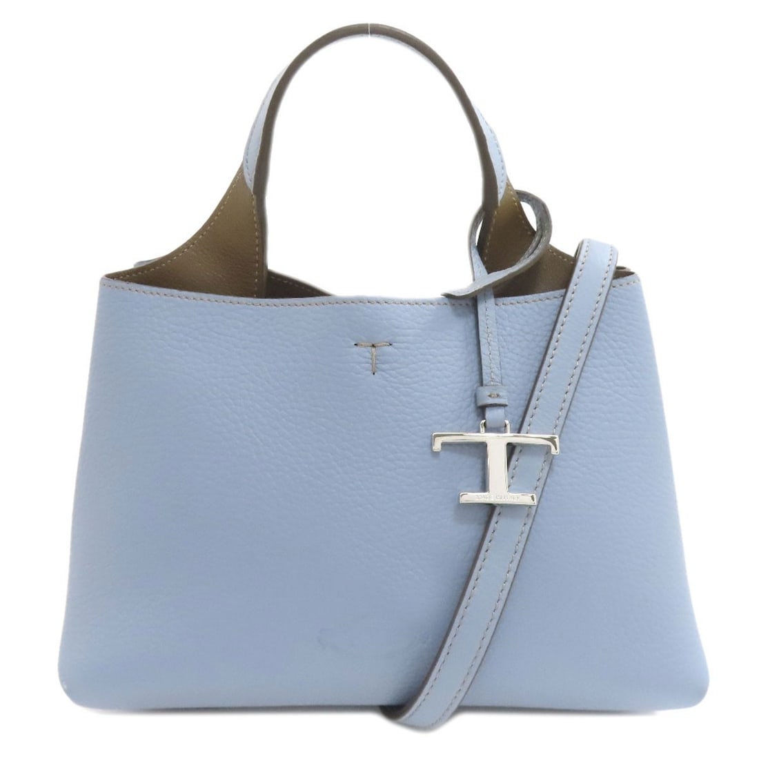 Handbag Calf Tods T 2Way Charm: Handbag Calf Tods T 2Way Charm Calf leather construction provides a sturdy base for this Tods handbag, with a 2-way charm closure that adds a touch of elegance. The bag's blue exterior is complemented