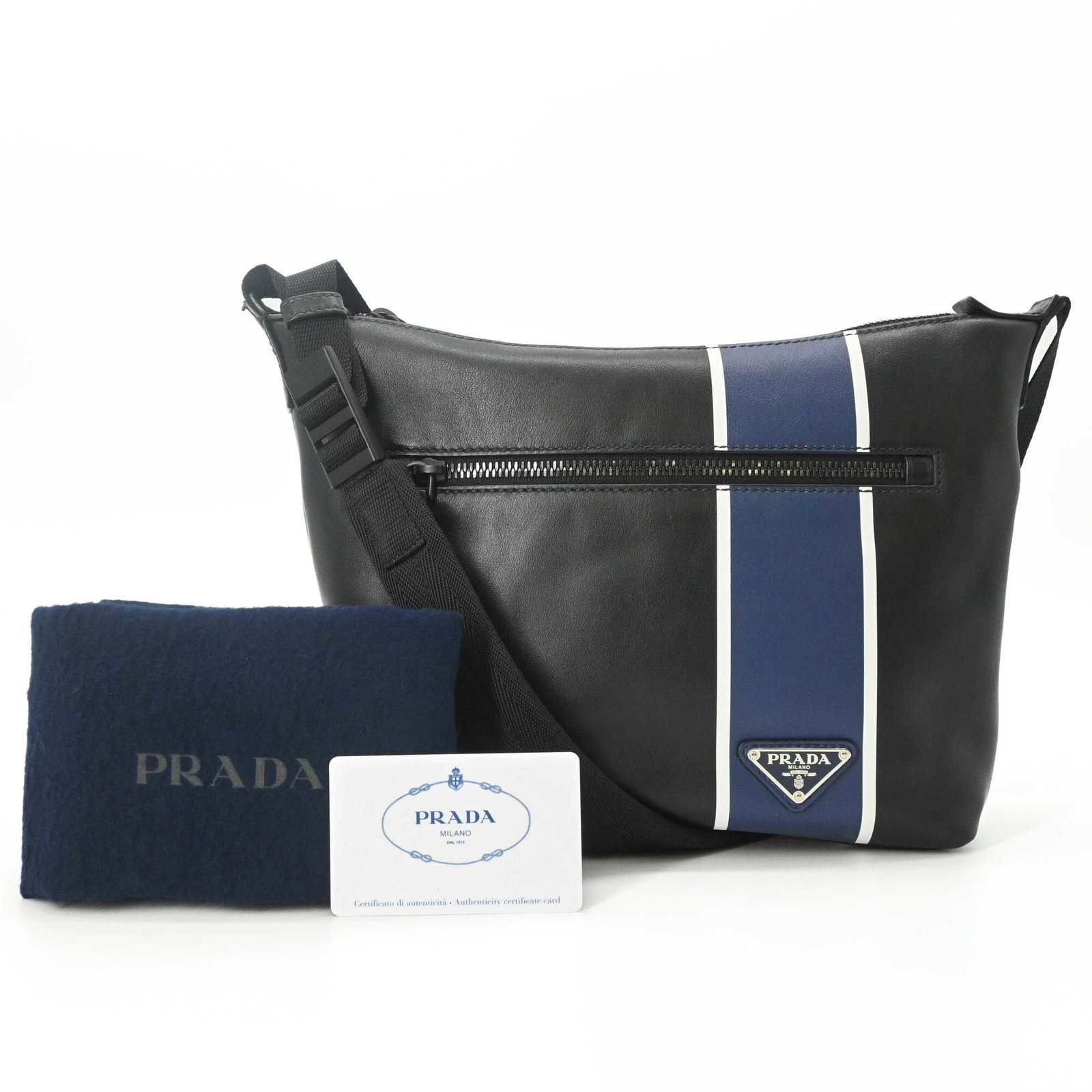Shoulder Bag Leather Prada: Shoulder Bag Leather Prada Black or Blue Leather Prada Shoulder Bag, 21cm x 24cm x 6cm. Made from high-quality leather, this shoulder bag features a sleek design with a classic Prada style. The bag's 