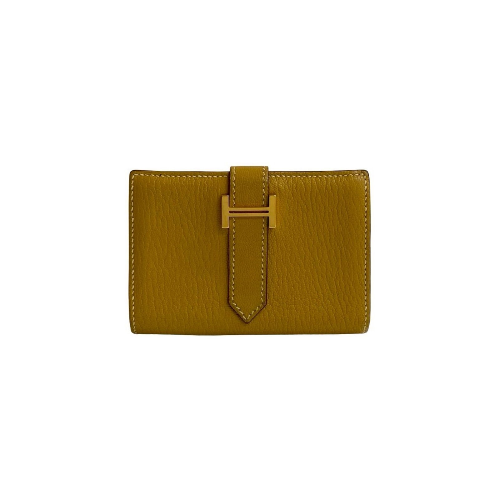 Chevre leather card case by Hermes: Chevre leather card case by Hermes Chevre leather card case by Hermes features a vibrant yellow color and a compact 7cm x 10cm x 1.5cm design, making it a stylish and portable accessory. The case is