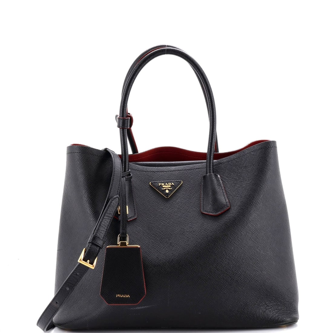 Saffiano Leather Cuir Tote Double Prada Medium: Saffiano Leather Cuir Tote Double Prada Medium Saffiano leather, a signature Prada material, gives this Cuir Double Tote its distinctive look and feel. The medium size and classic design make it a