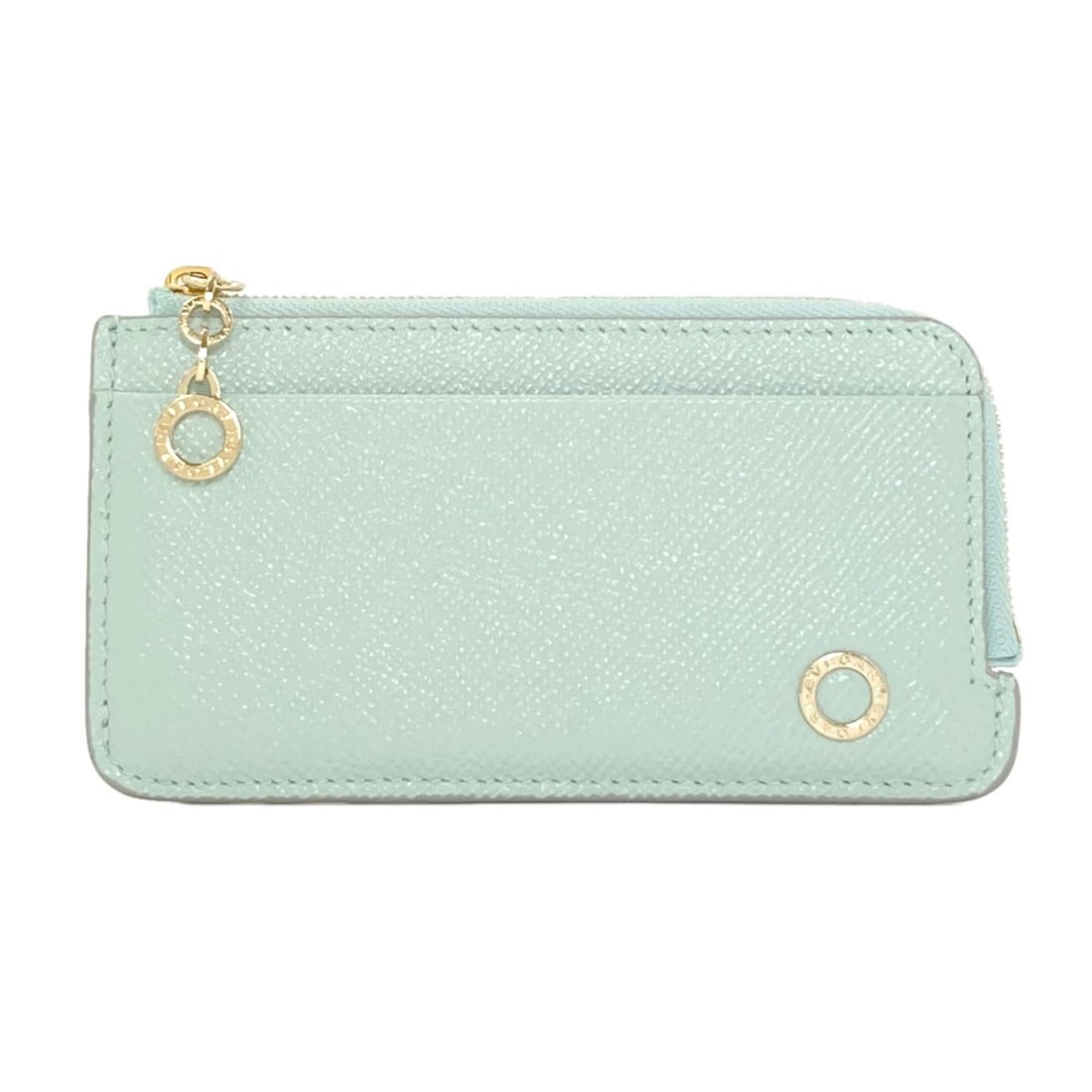 Bvlgari Card Case Leather: Bvlgari Card Case Leather Bvlgari Card Case Leather is a stylish accessory made from high-quality leather, available in a vibrant green color. The card case features a zip closure and bears a signatur