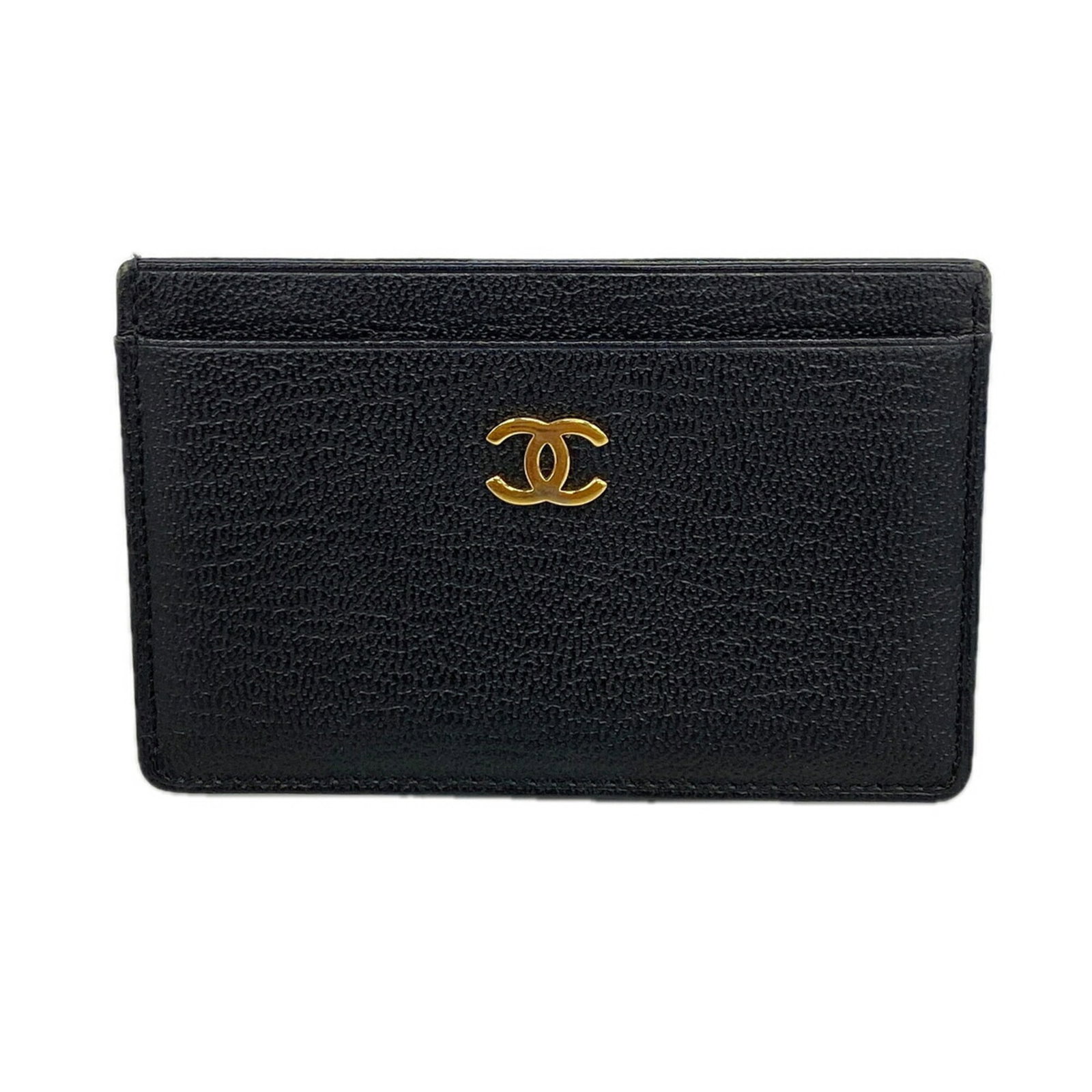 Chanel Card Case Leather: Chanel Card Case Leather Black leather card case from Chanel, measuring 7cm x 10.5cm x 5mm. Made from high-quality leather, this card case features a sleek and sophisticated design. A classic