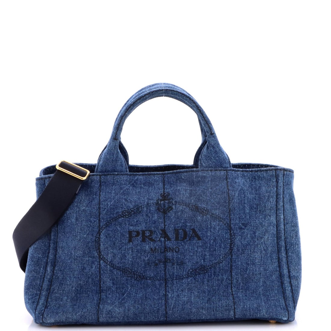 Convertible Tote Canapa Prada Medium Denim: Convertible Tote Canapa Prada Medium Denim The Prada Canapa Convertible Tote in Medium Denim is a versatile and stylish accessory. With its convertible design and durable denim exterior, this tote can