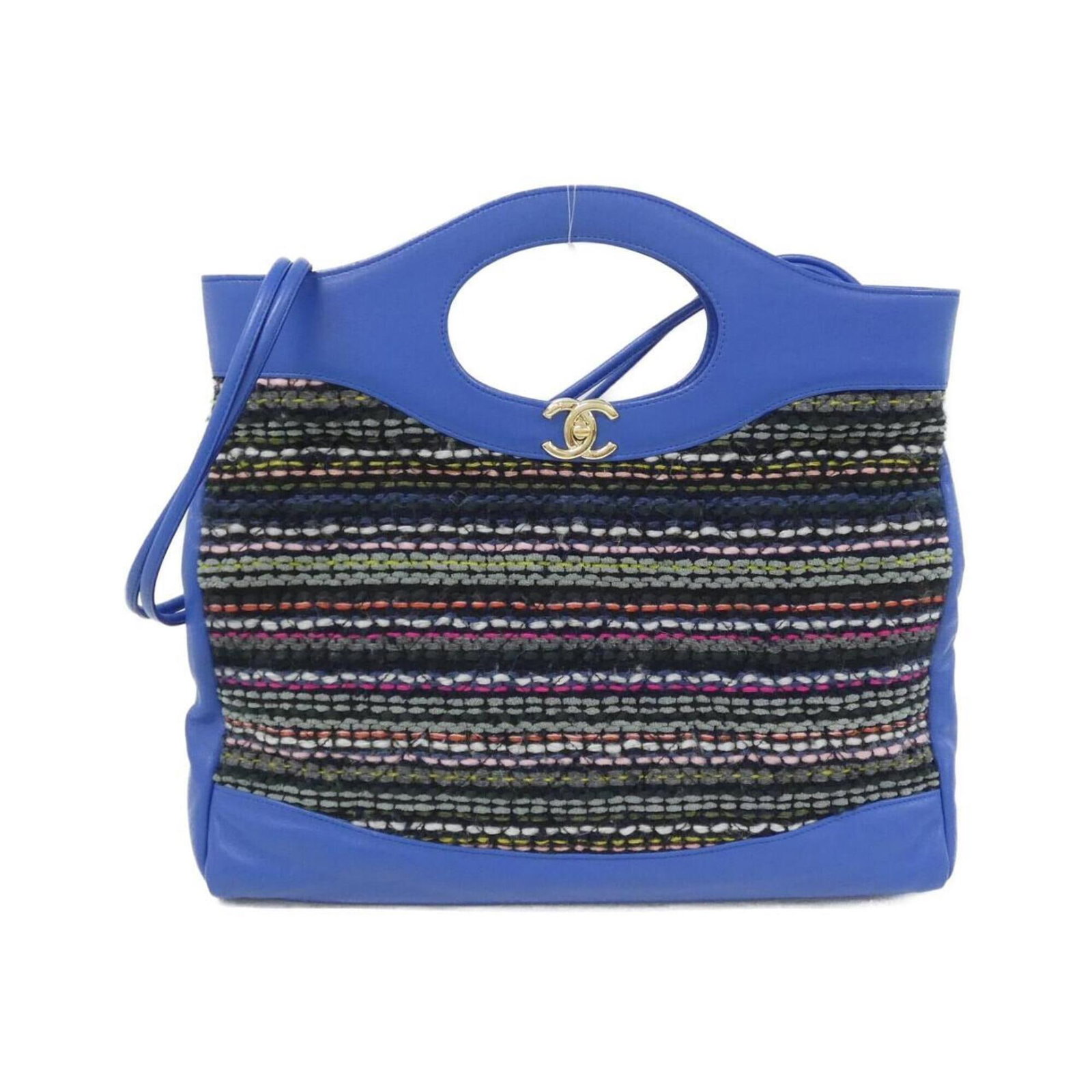 Tweed leather handbag Chanel: Tweed leather handbag Chanel Tweed leather handbag from Chanel, featuring a unique blue and multi-color design, gold hardware, and a classic 34cm x 39cm x 8cm size. This stylish bag is crafted from