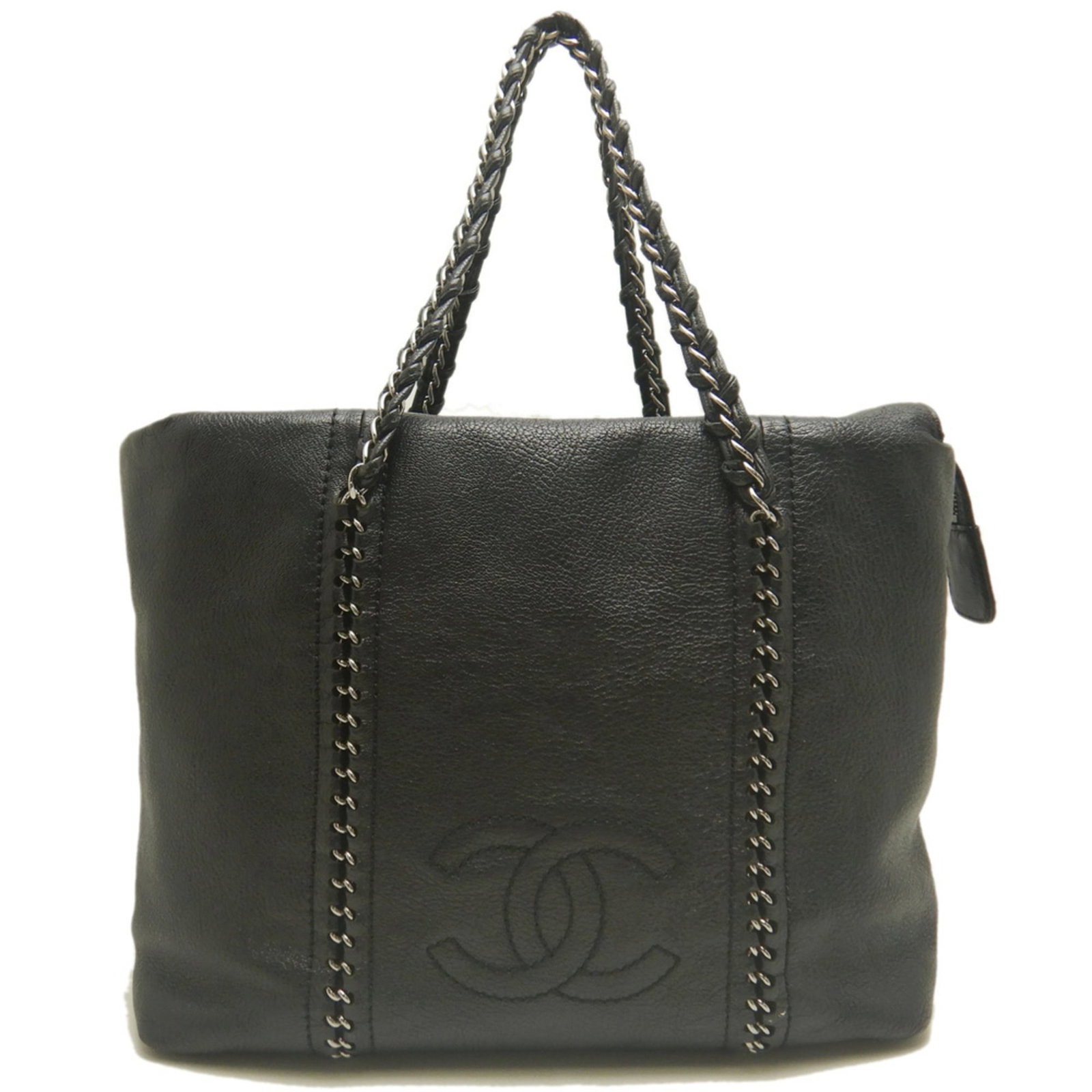 Leather Chanel Tote Bag: Leather Chanel Tote Bag This black leather Chanel tote bag boasts a sleek and sophisticated design, featuring a silver zipper closure and classic Chanel hardware. Measuring 28cm x 42cm x 12cm, it is