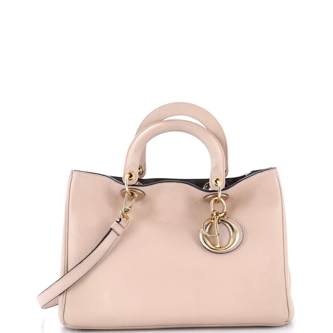 Christian Dior Diorissimo Pebbled Leather Medium Tote: Christian Dior Diorissimo Pebbled Leather Medium Tote Christian Dior's Diorissimo Pebbled Leather Medium Tote boasts a neutral exterior with subtle pebbled leather detailing, adding a touch of