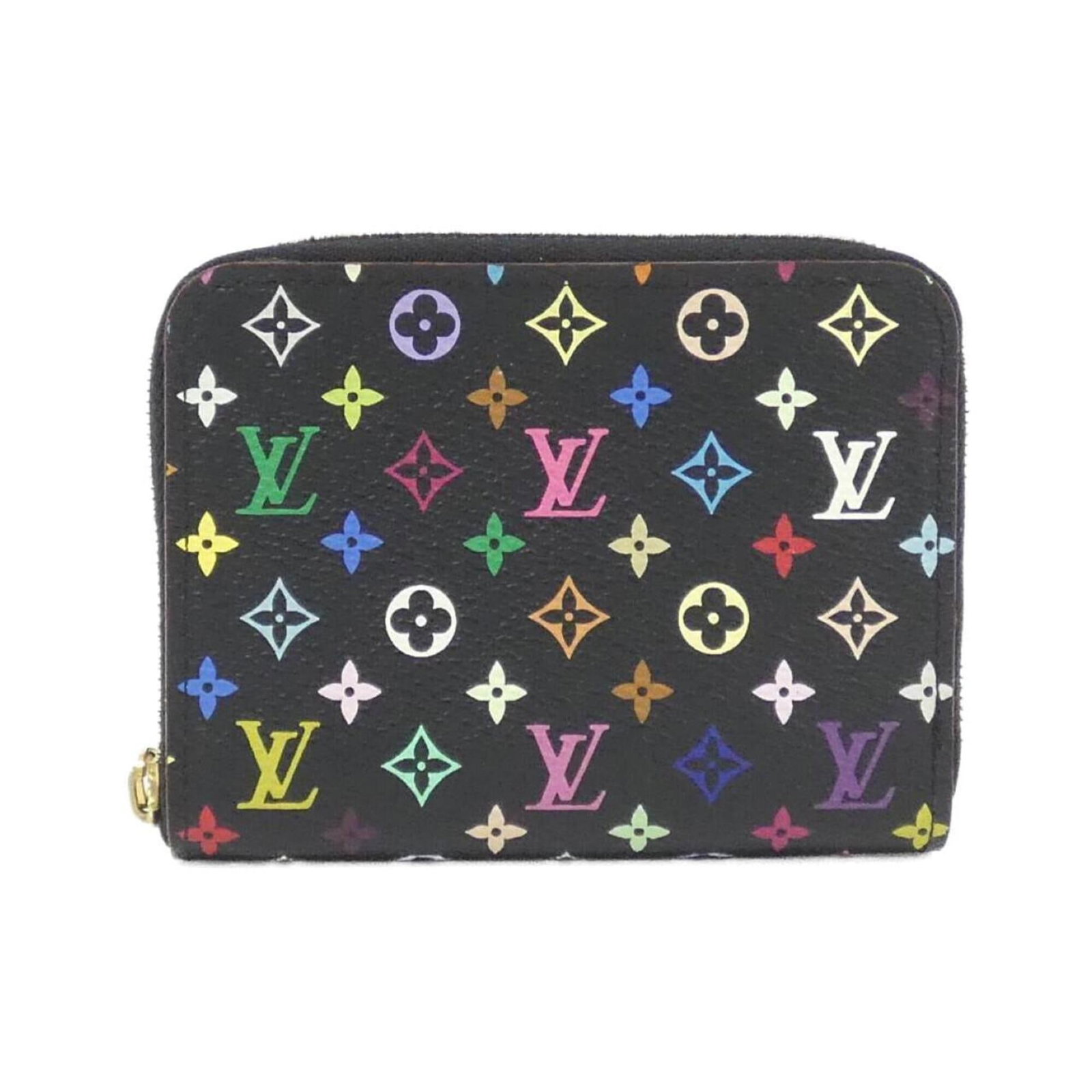 Louis Vuitton Coin Purse/ Coin Case Coated Canvas: Louis Vuitton Coin Purse/ Coin Case Coated Canvas Coated canvas construction gives this Louis Vuitton coin purse a durable and stylish touch, while its sleek black and violet color combination adds a