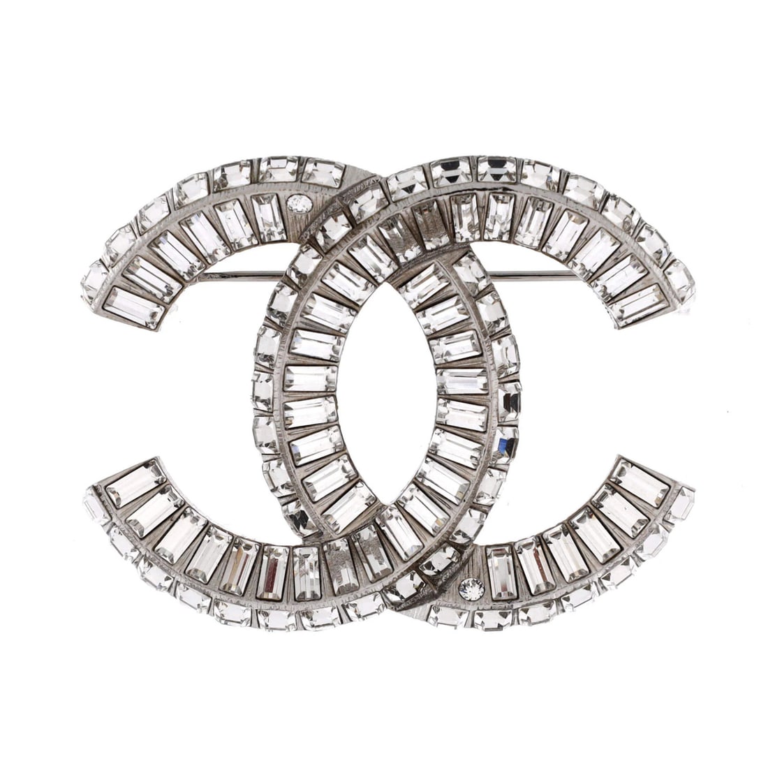 Metal Chanel Crystals CC Baguette with Brooch: Metal Chanel Crystals CC Baguette with Brooch Silver Chanel CC Baguette brooch features a striking metal and crystal design, with a unique brooch style that adds a touch of elegance to any outfit. The
