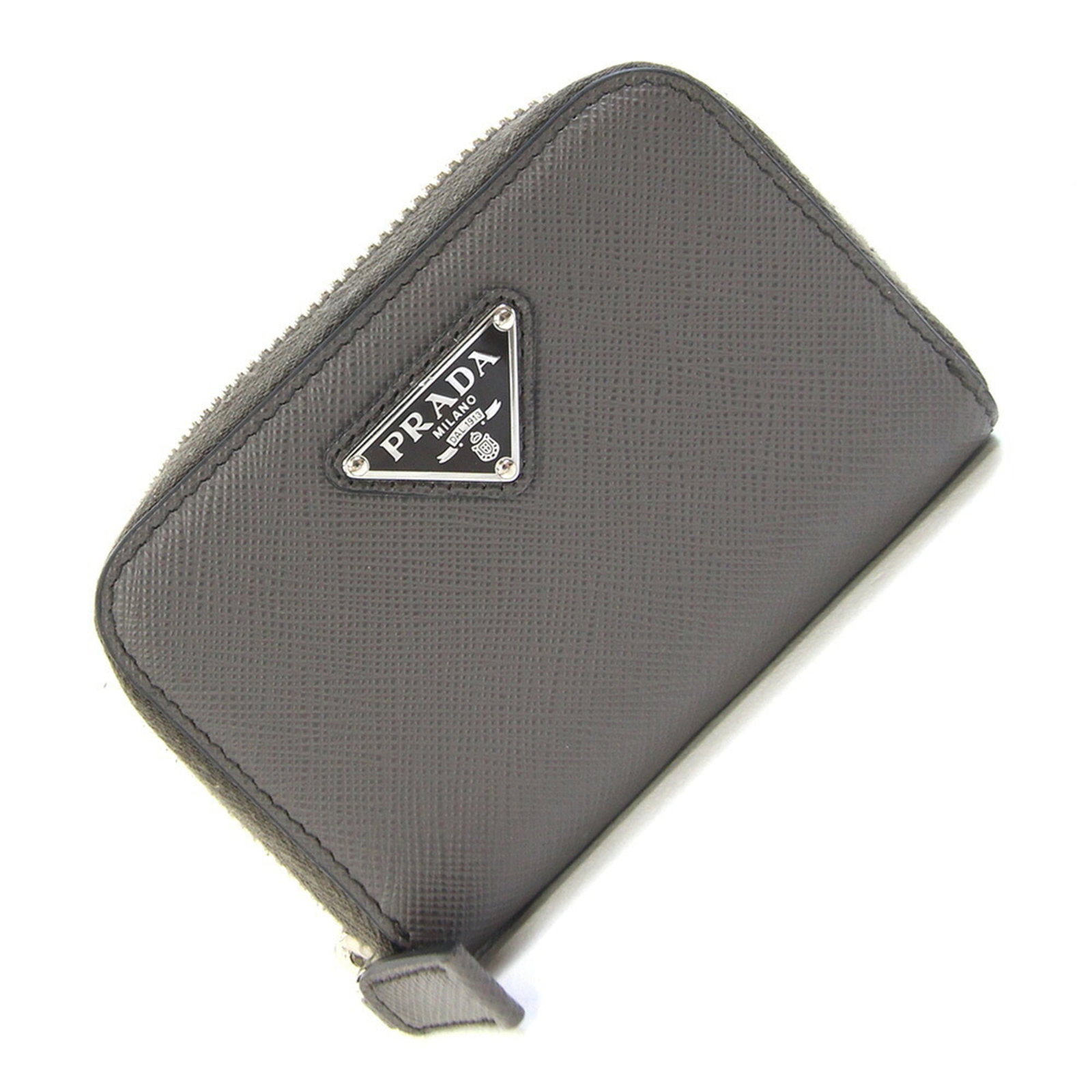 Coin purse case leather: Coin purse case leather The Prada MPN 2MM003 coin purse case is a sleek, gray leather accessory. Measuring 11cm x 7.5cm x 2cm, it offers a compact storage solution. Its simple design makes it a versat