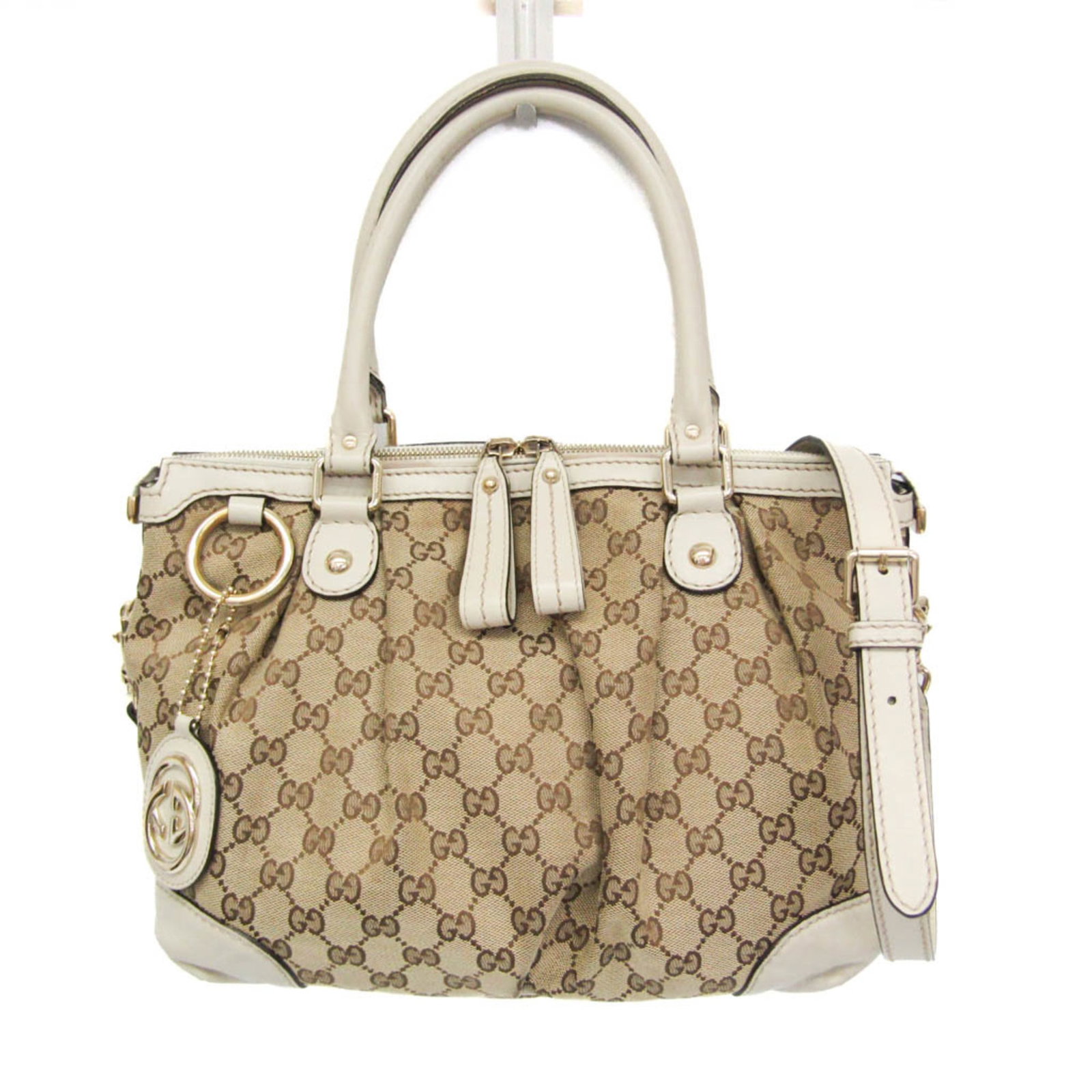 Shoulder Bag Canvas Leather Handbag Gucci: Shoulder Bag Canvas Leather Handbag Gucci Gucci's iconic Sukey shoulder bag features a timeless design with a mix of leather and GG canvas. This beige and off-white colorway adds a touch of elegance, 