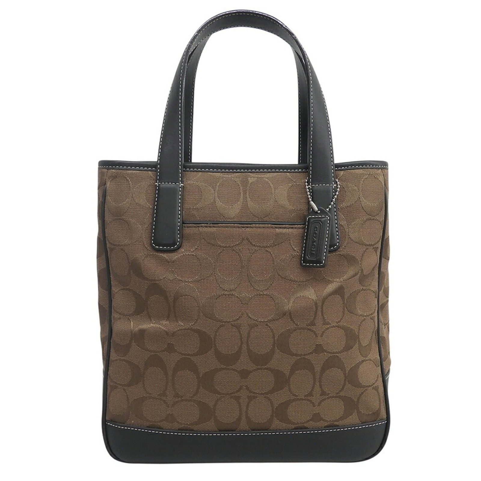 Handbag Canvas Leather Coach: Handbag Canvas Leather Coach Canvas and leather combine in this classic Coach handbag, offering a timeless design with a brown finish. The bag measures 26.5cm x 23cm x 10cm, making it a compact and st